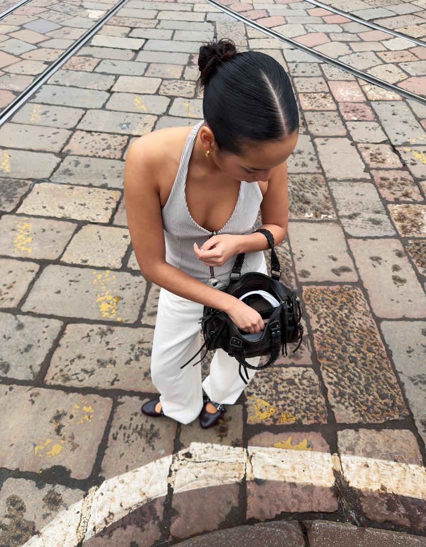 Worn-effect bowling bag with straps