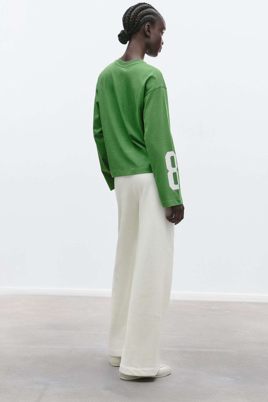 T-SHIRT WITH EMBROIDERED SLOGAN