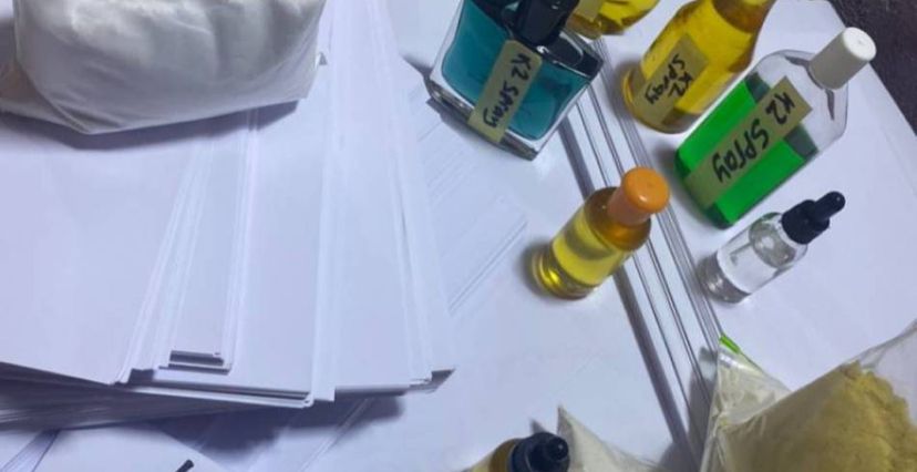 K2 Herbal Spray on sheet of paper