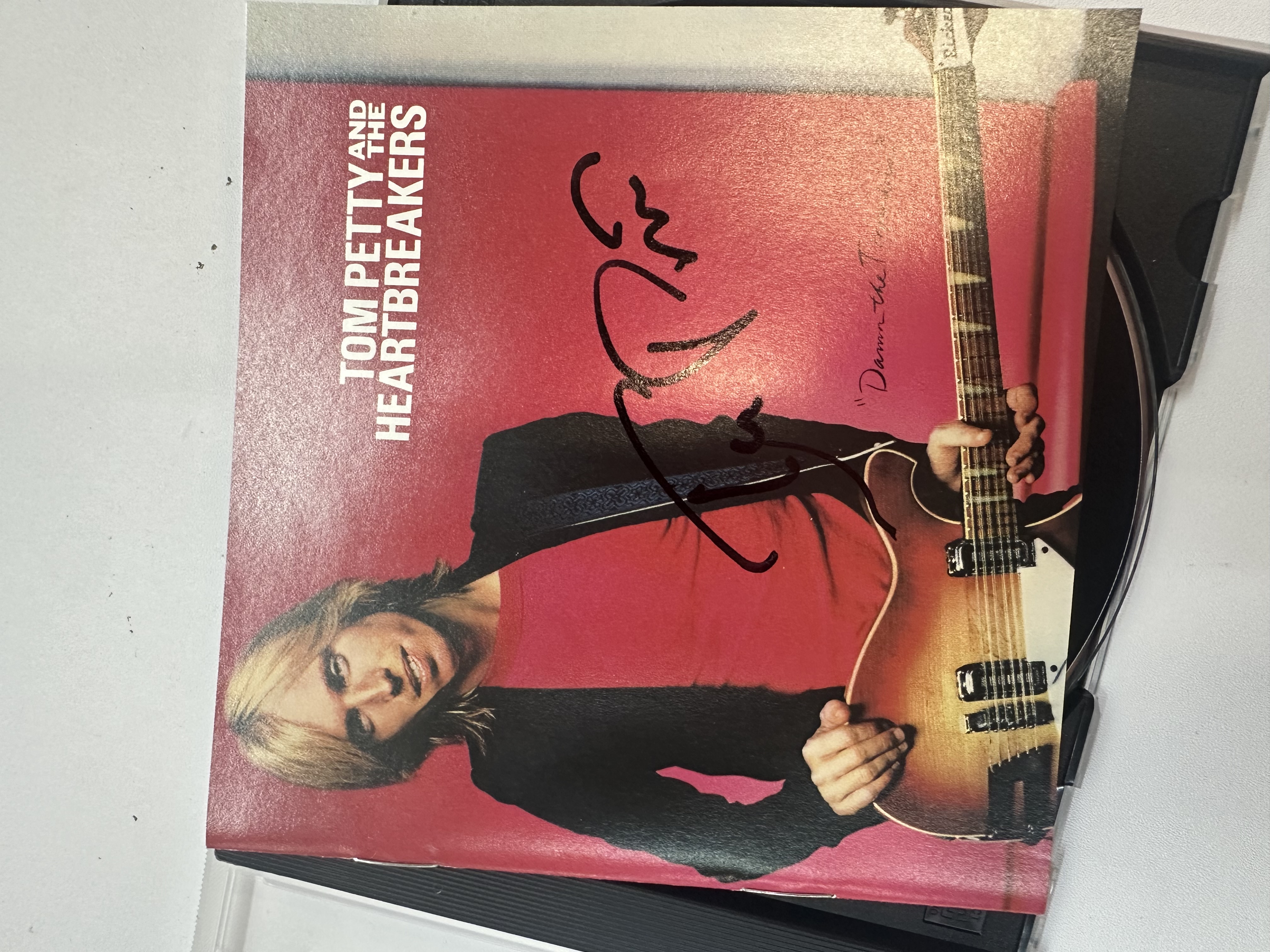 A1337 Tom Petty and the Heartbreakers damn the torpedoes signed autographed CD booklet signed by Tom Petty