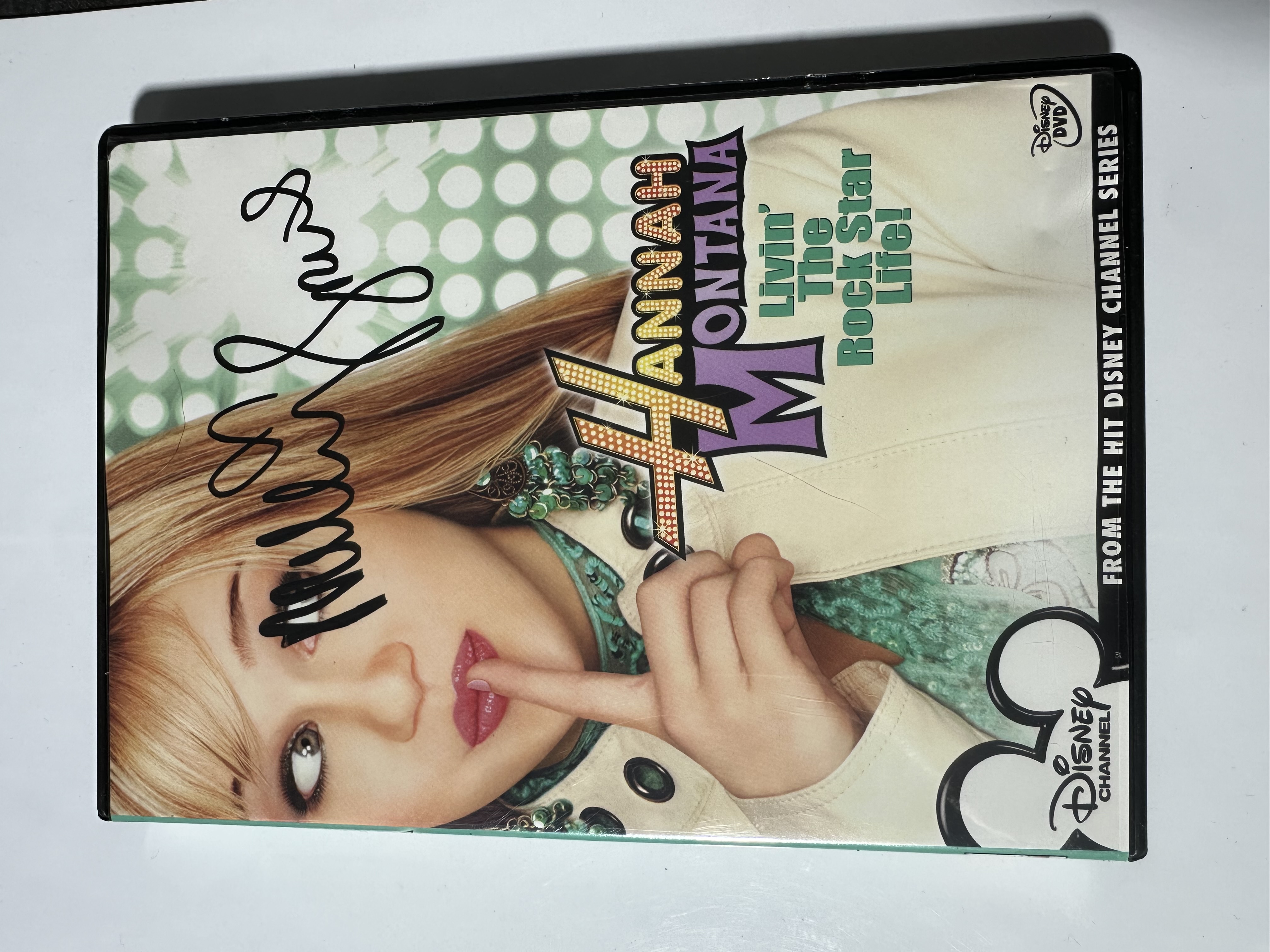 A2604 Hannah Montana live in the rockstar life signed autograph DVD by Miley Cyrus