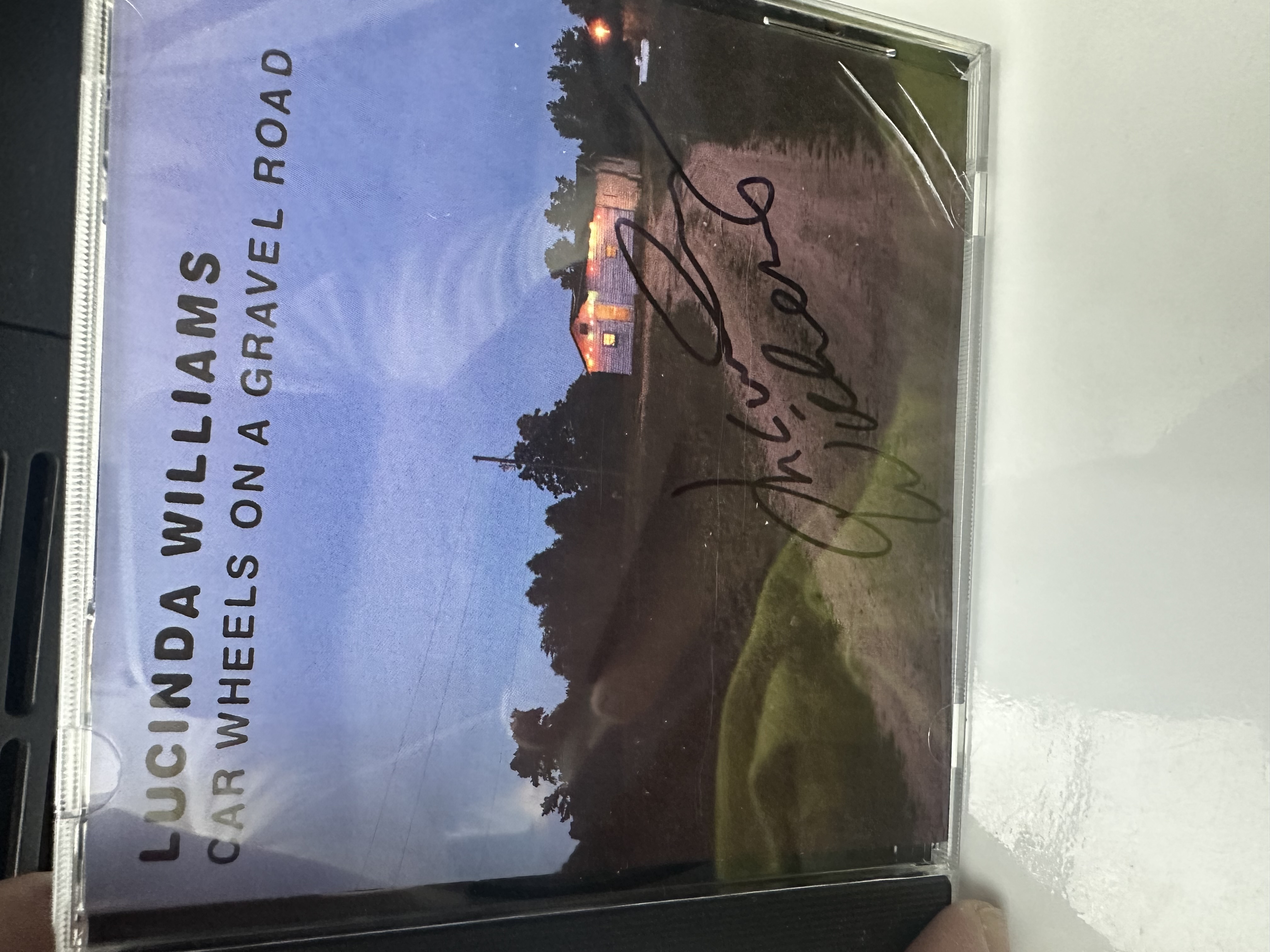 A22039 lucinda Williams car wheels on a gravel road signed autographed CD