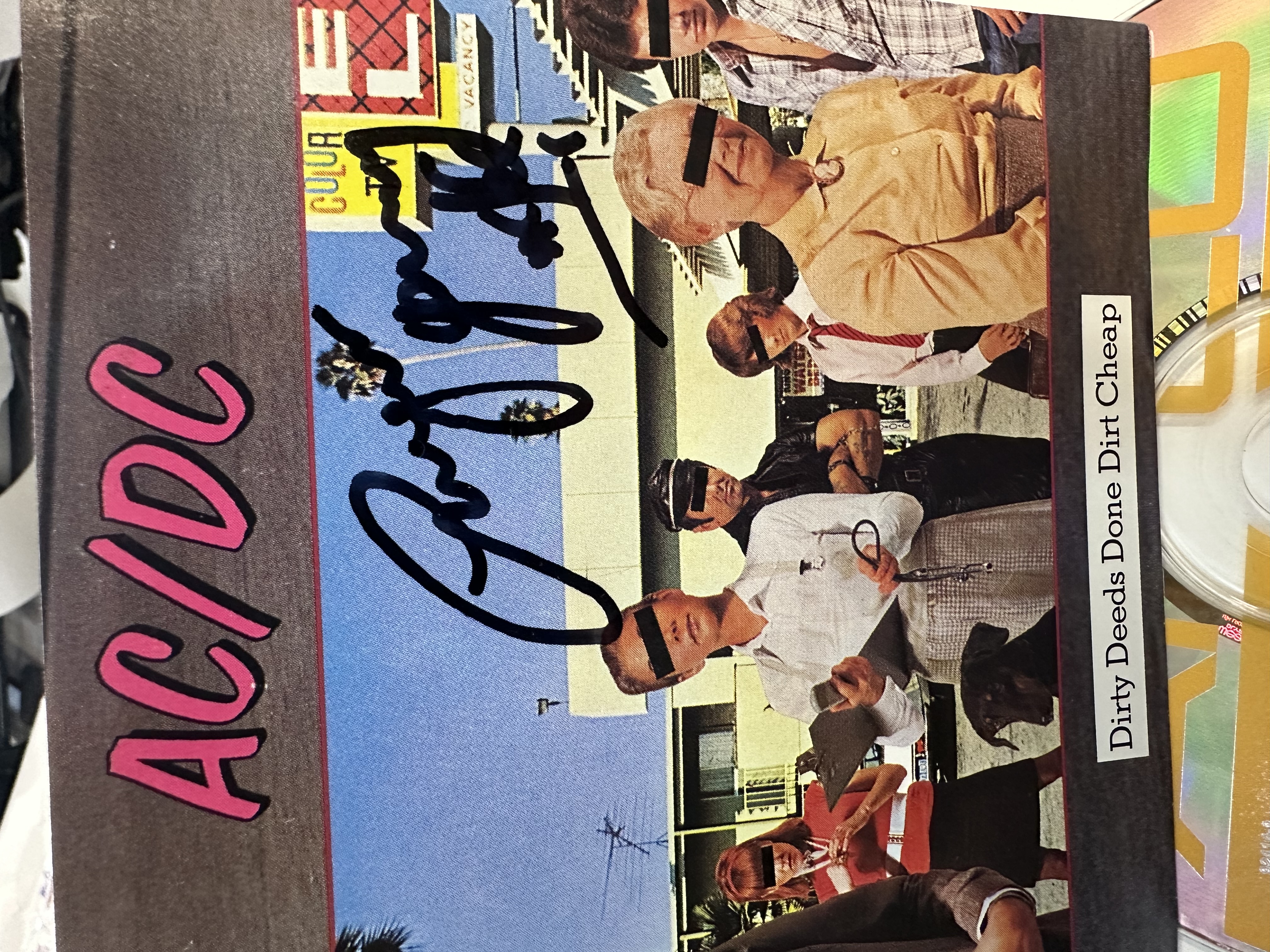 B112352 AC/DC dirty deeds, done, dirt, cheap, signed, framed CD signed by Angus Young. 