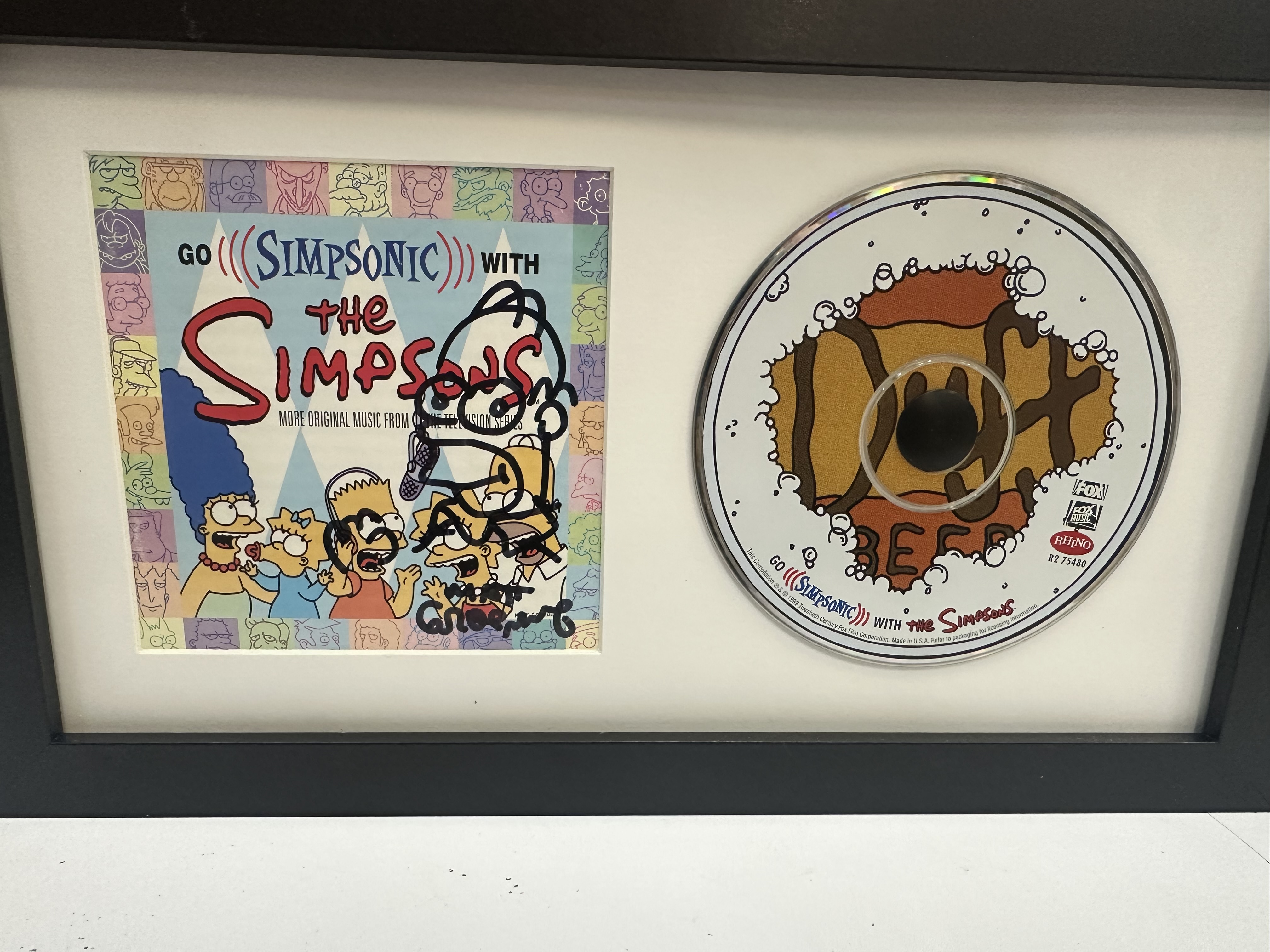 B112372 The Simpsons signed CD booklet signed by Matt Groening with Homer Simpson doodle