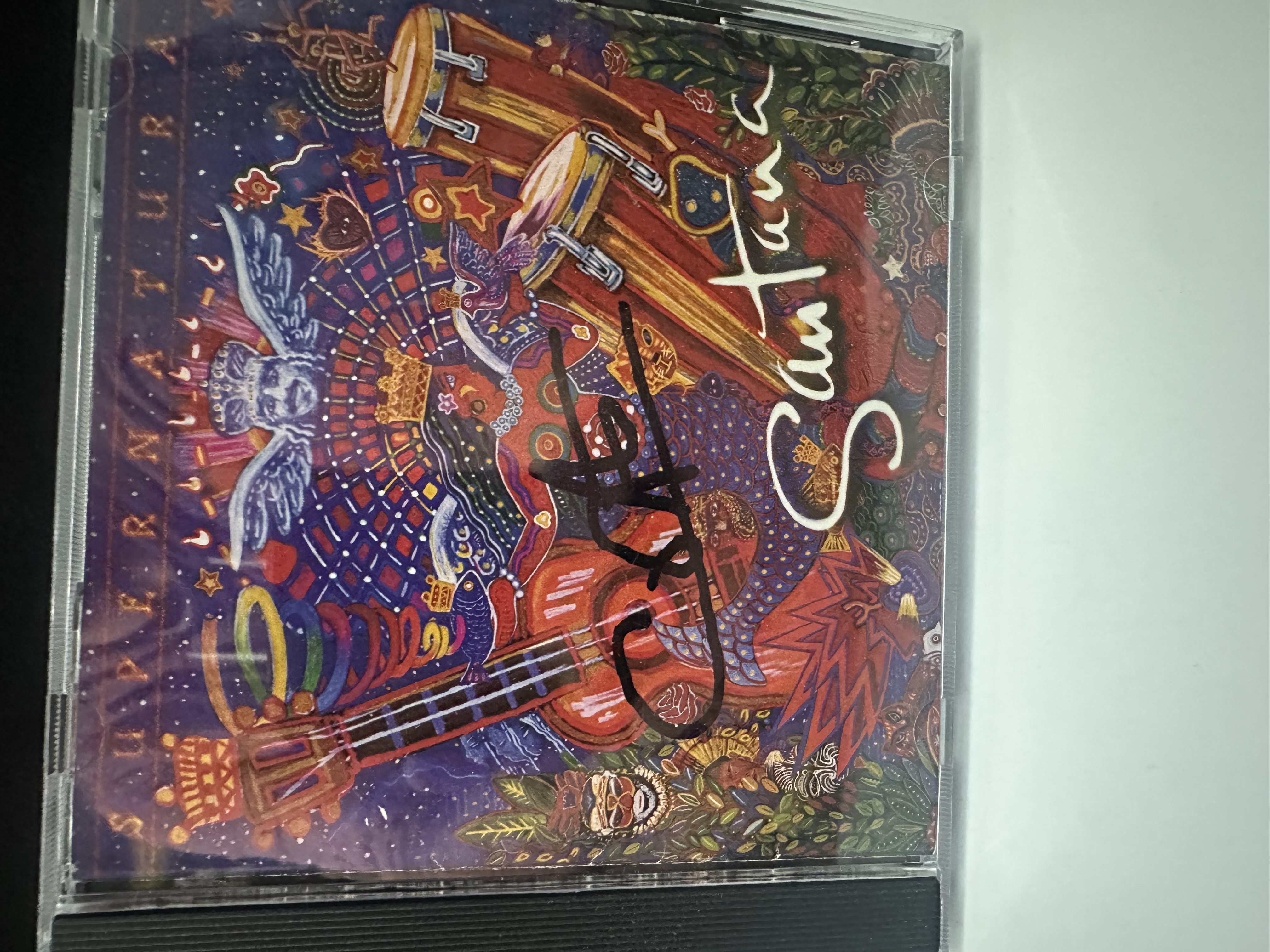 B112852 Santana supernatural signed autograph CD booklet signed by Carlos Santana