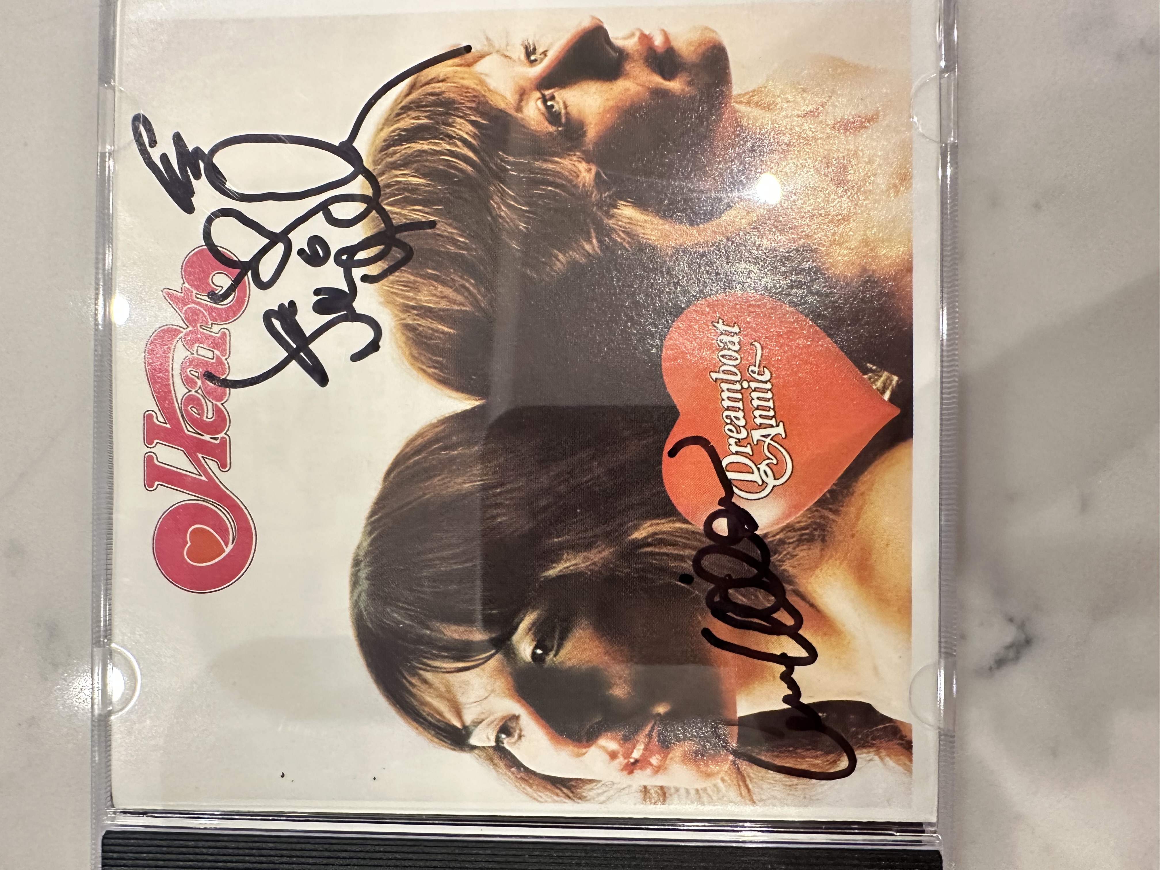 B112511 heart dreamboat Annie signed autograph CD booklet signed by Anne Wilson, and Nancy Wilson