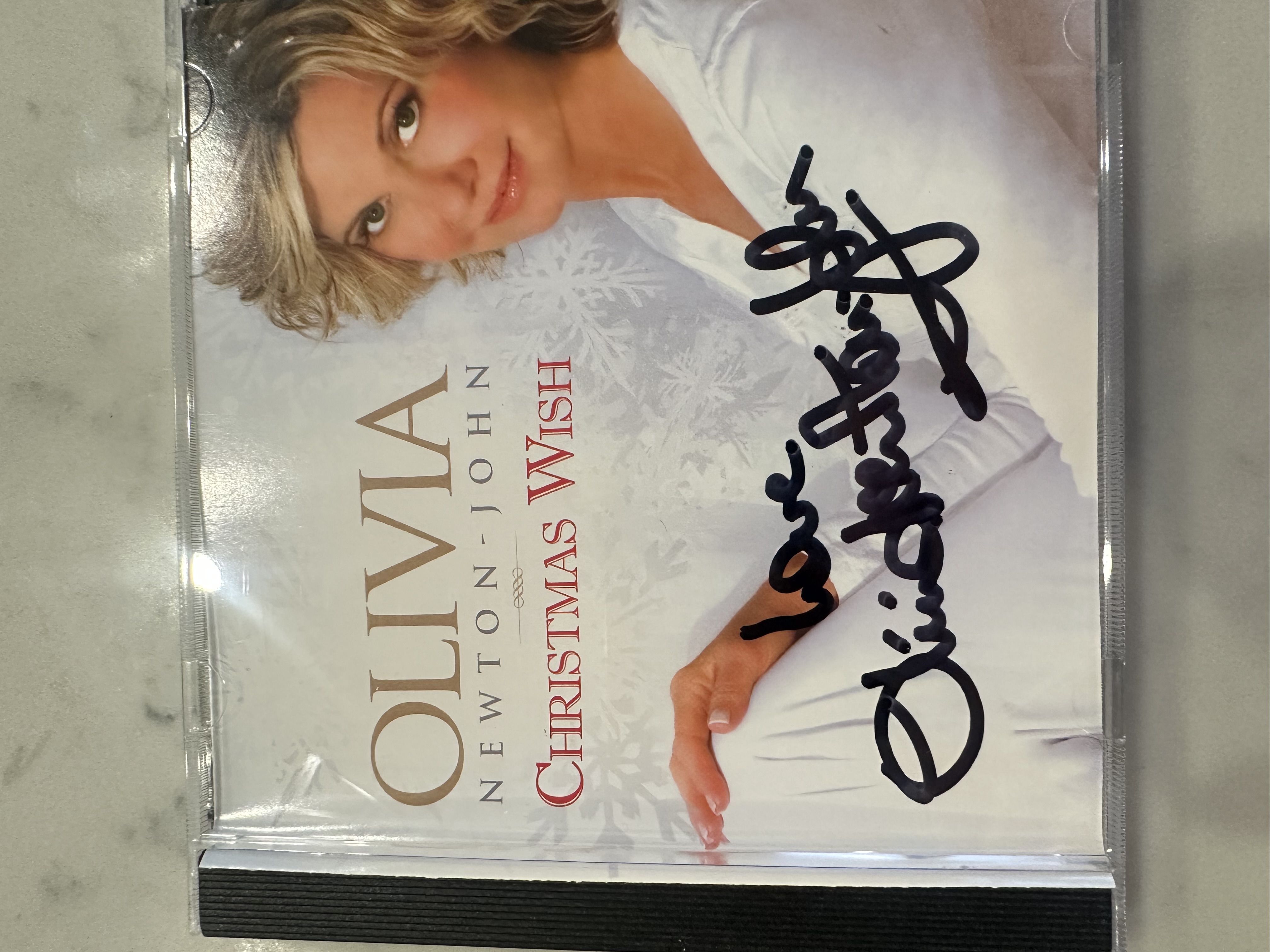 B112811 Olivia Newton-John Christmas wish signed autograph CD booklet