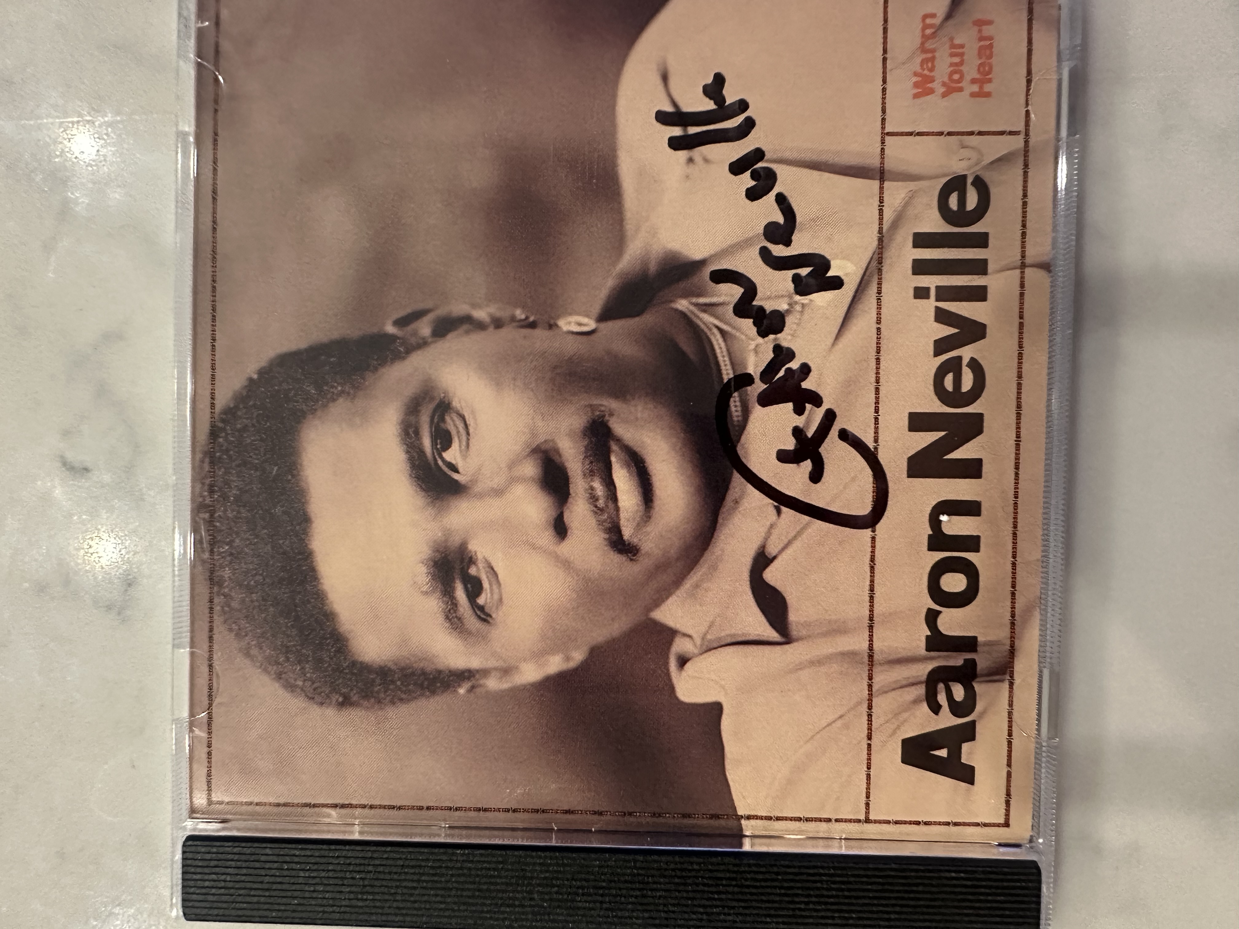 B 112631 Aaron Neville warm your heart signed autograph CD booklet