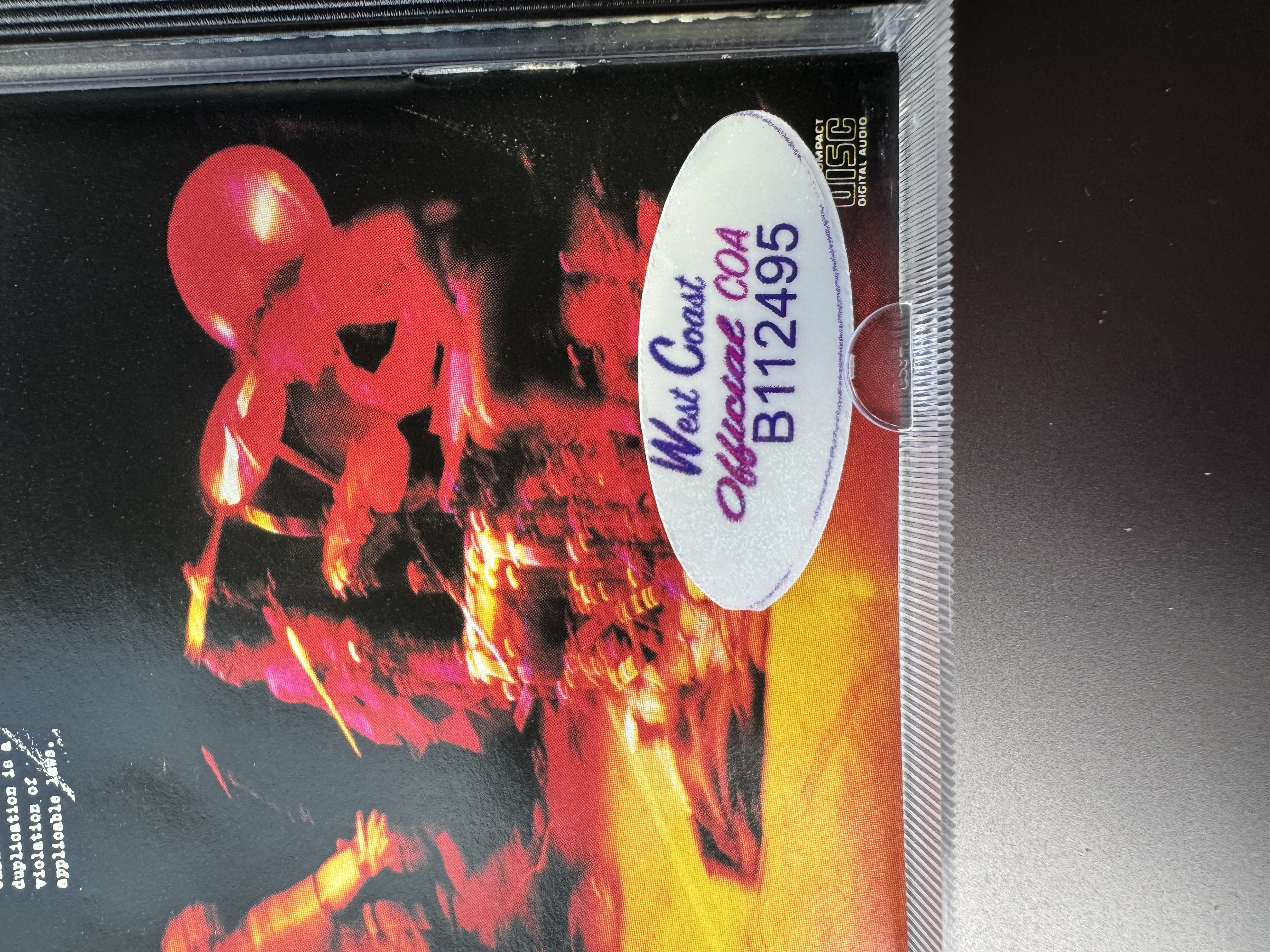 B112495 rage against the machine signed CD signed by Tom Morello