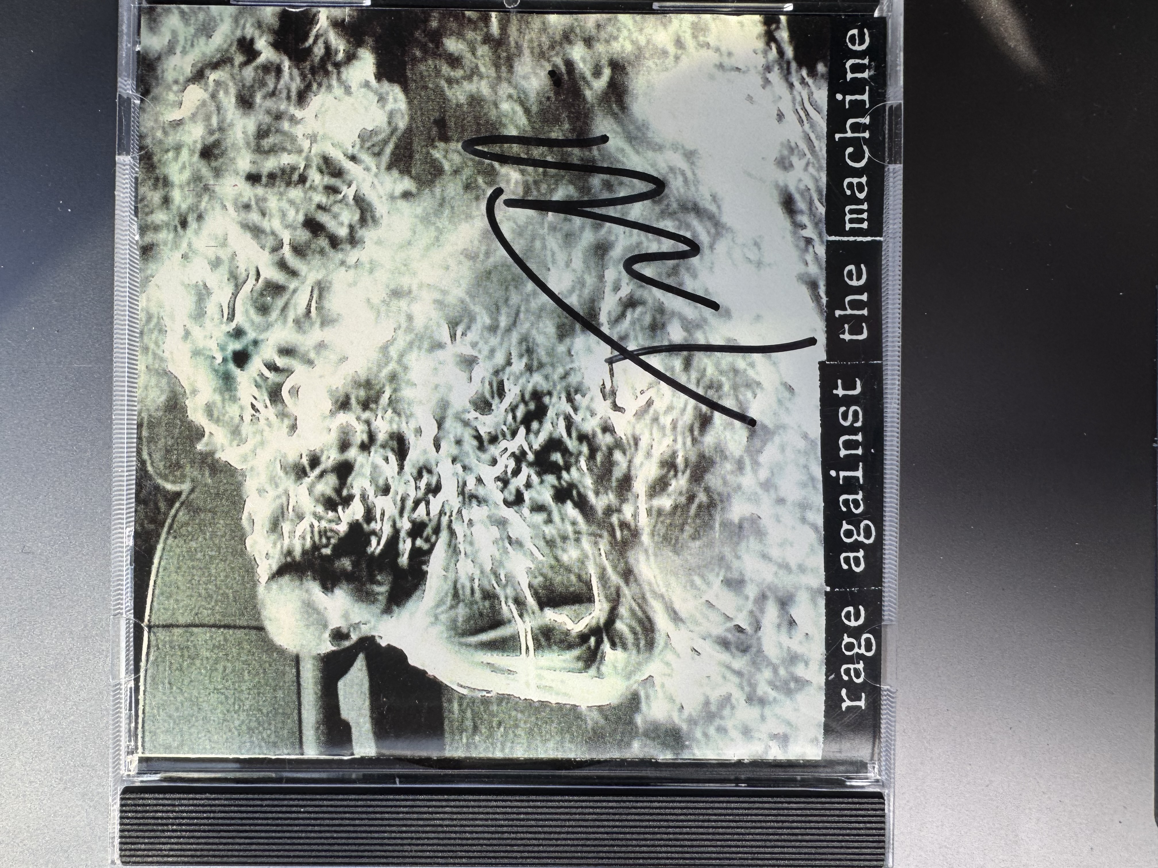 B112495 rage against the machine signed CD signed by Tom Morello