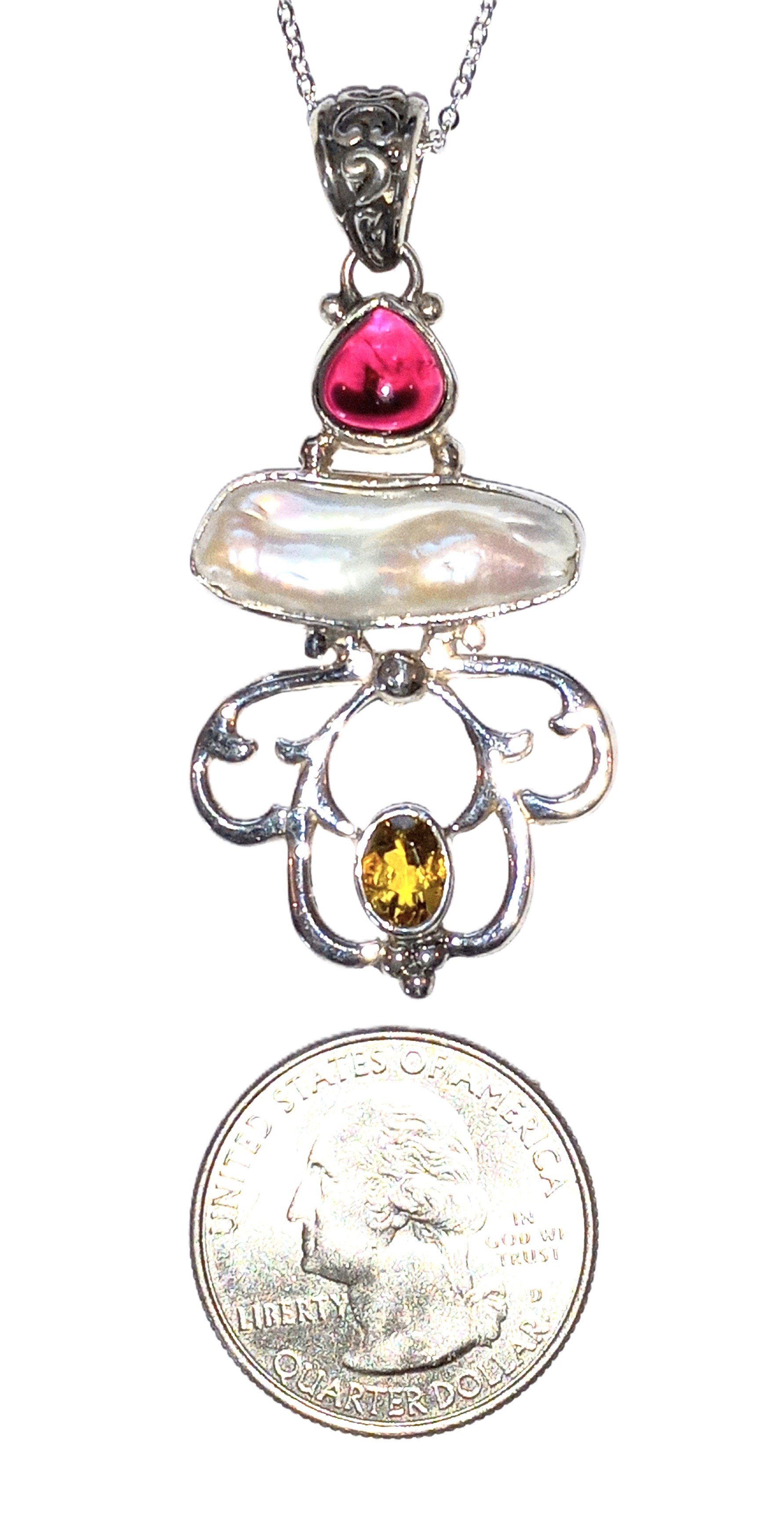 Multiple stone pendant in sterling silver.