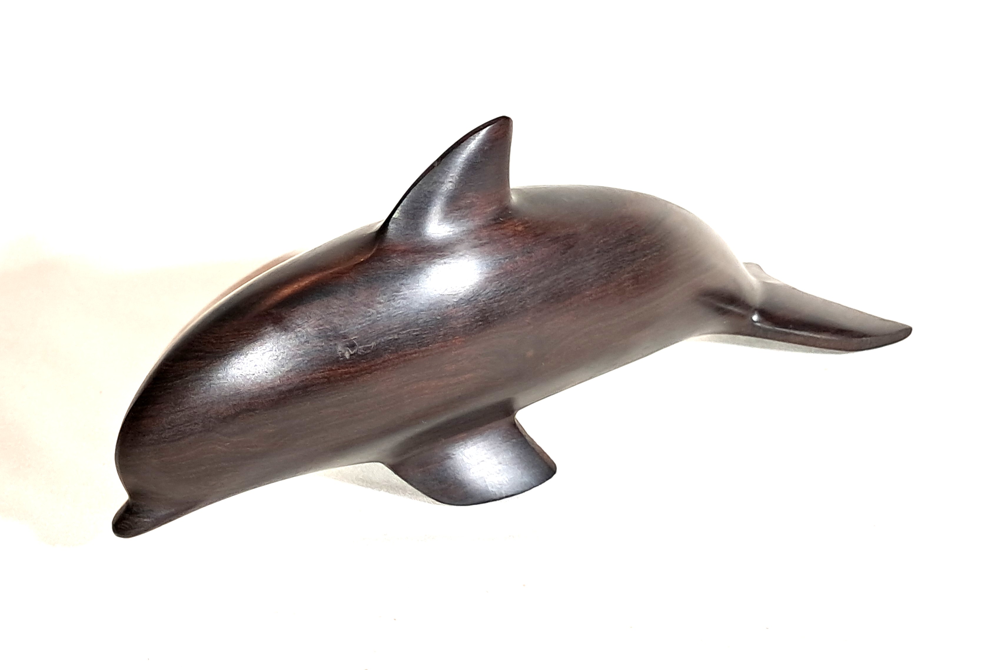 Ironwood dolphin sculpture.