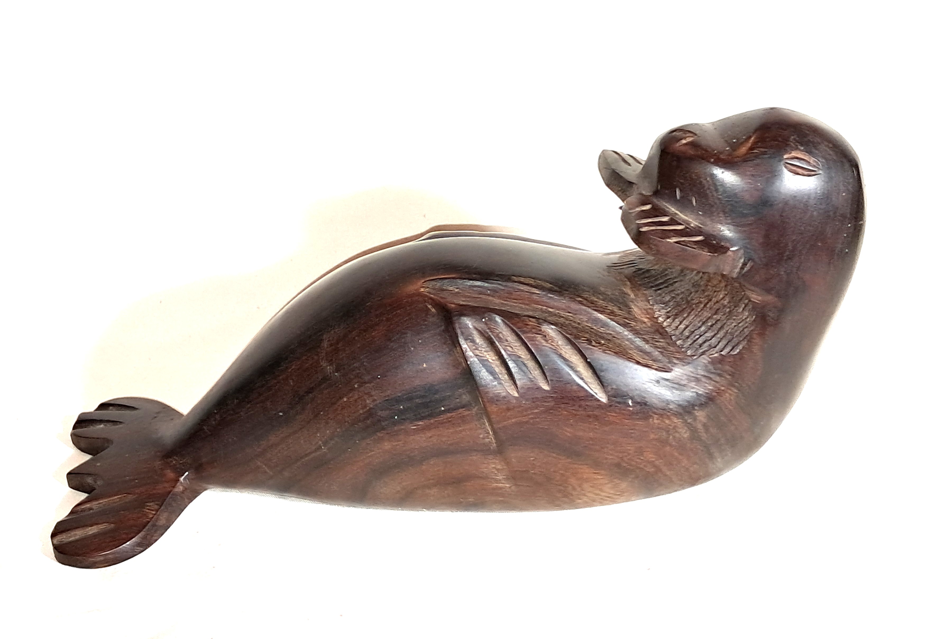 Ironwood otter sculpture.