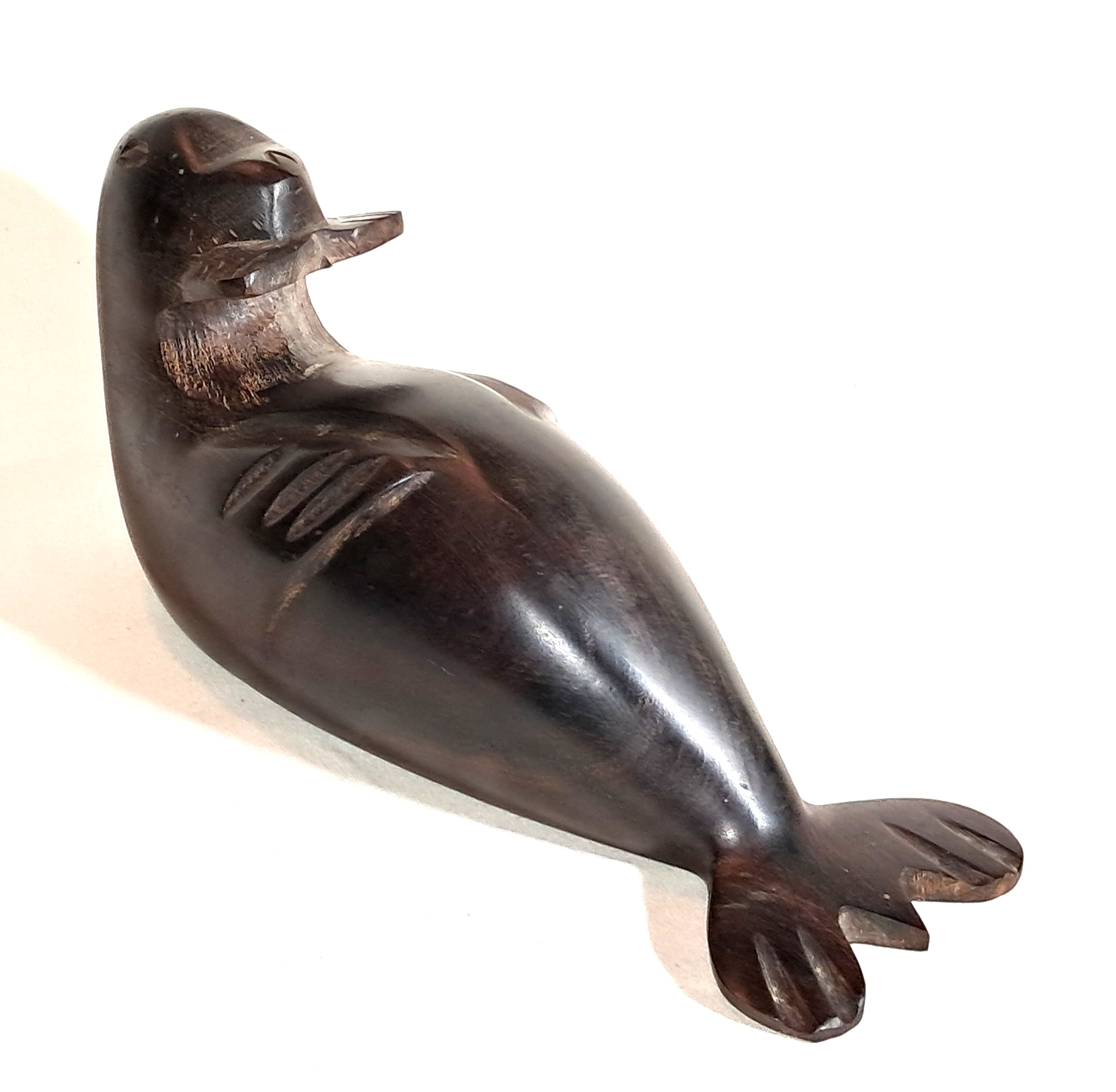 Ironwood otter sculpture.