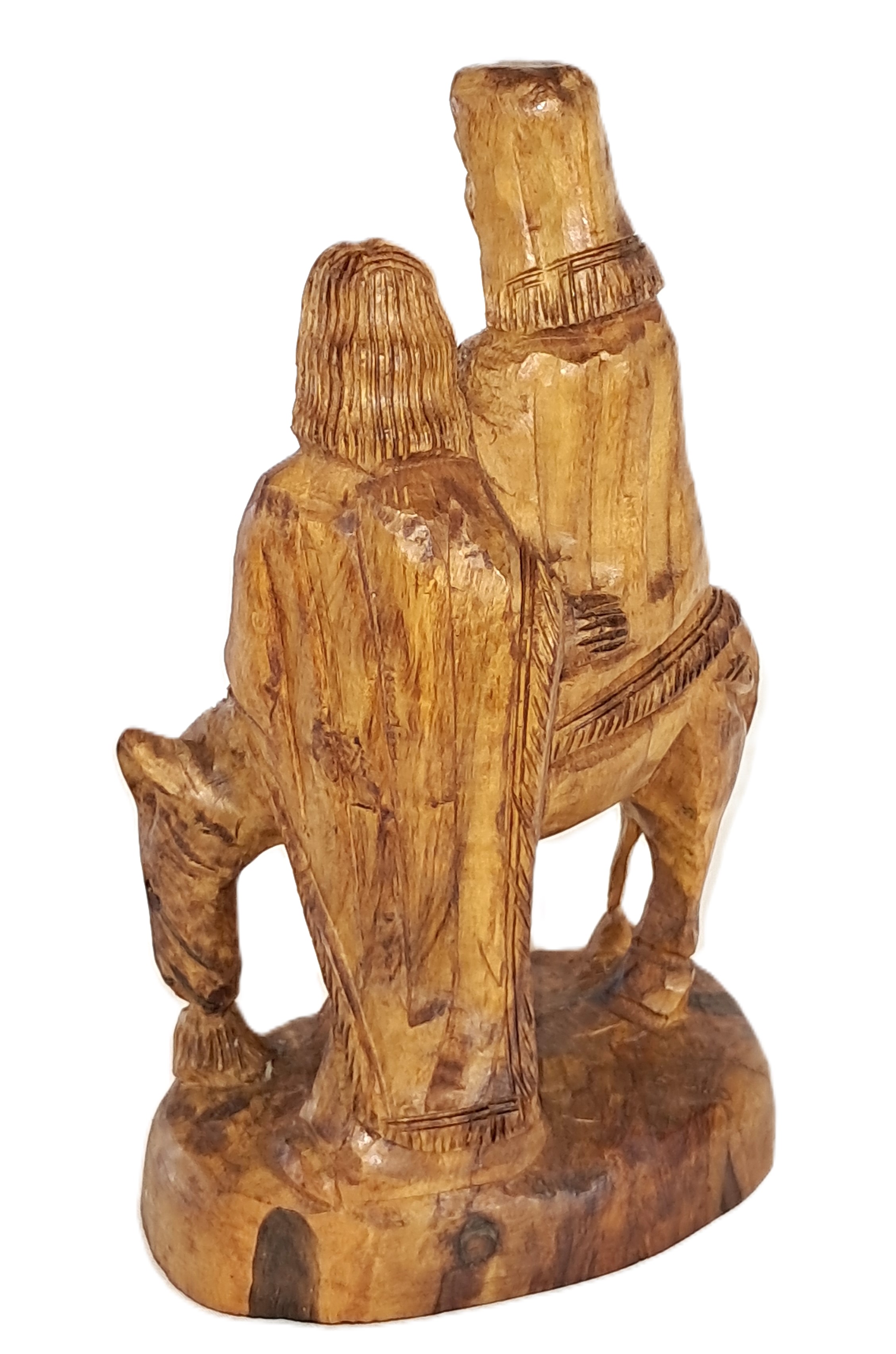Holy family traveling, wood sculpture.