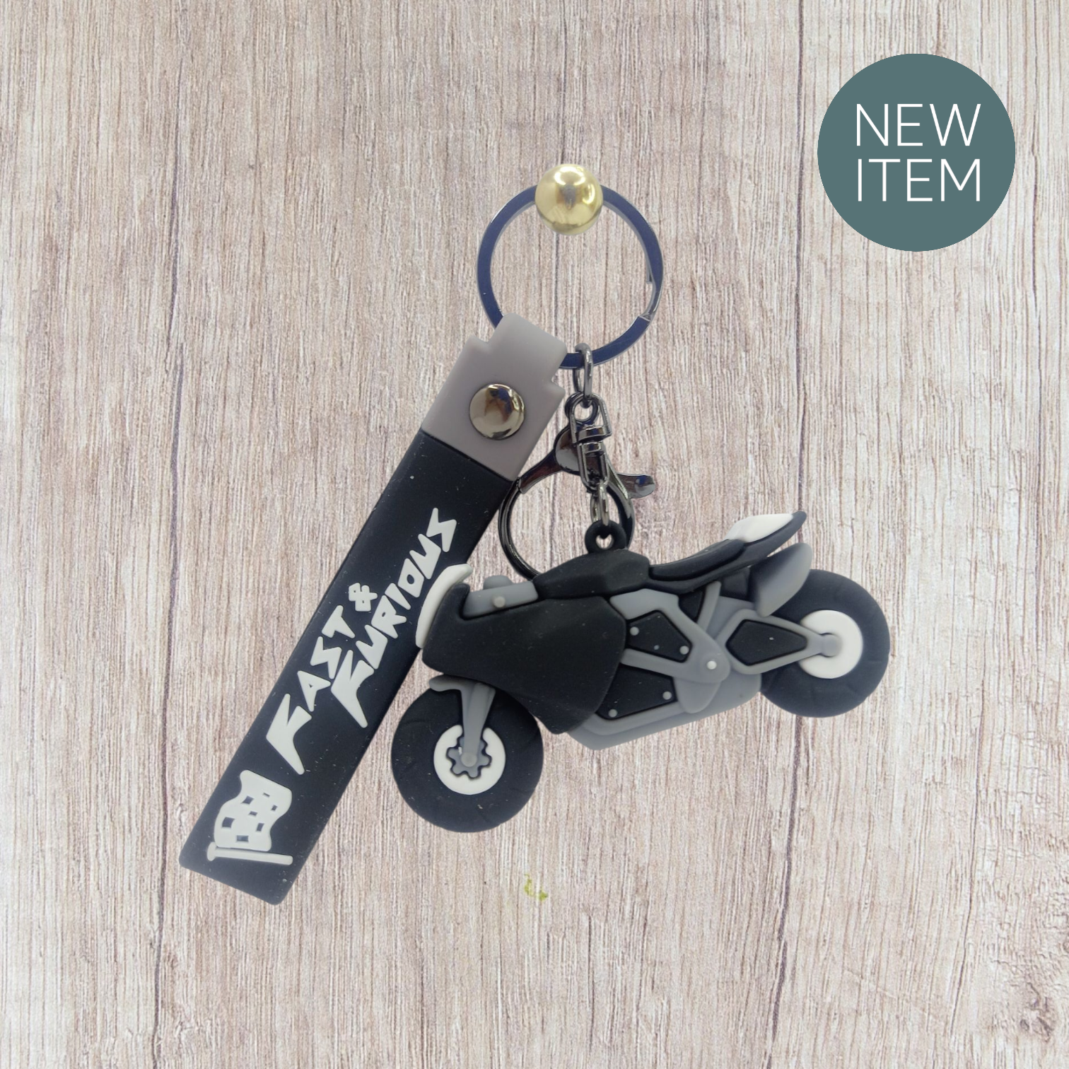 Stylish grey & black motorcycle keychain with rubber strap – perfect for biker keys, backpacks, or gifting