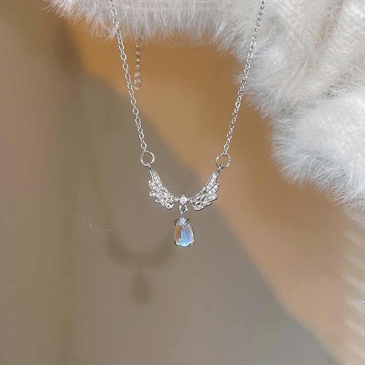 Shop elegant moonstone angel wings pendant necklaces — brass clavicle chain jewelry for women, perfect for daily wear, special occasions, and gifting.