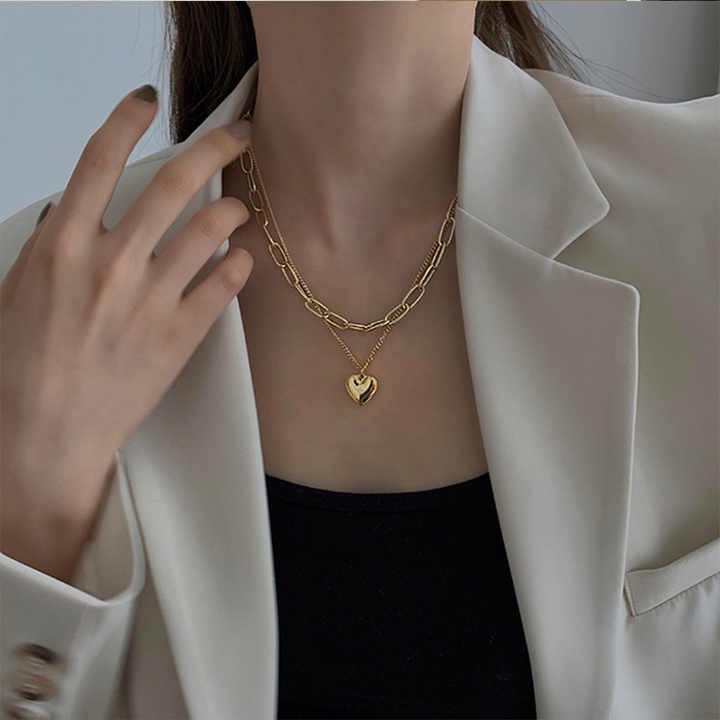 Chic multi-layer heart necklace with gold plating, featuring half pearl, half chain design — high-quality custom jewelry for women’s fashion and gifting.