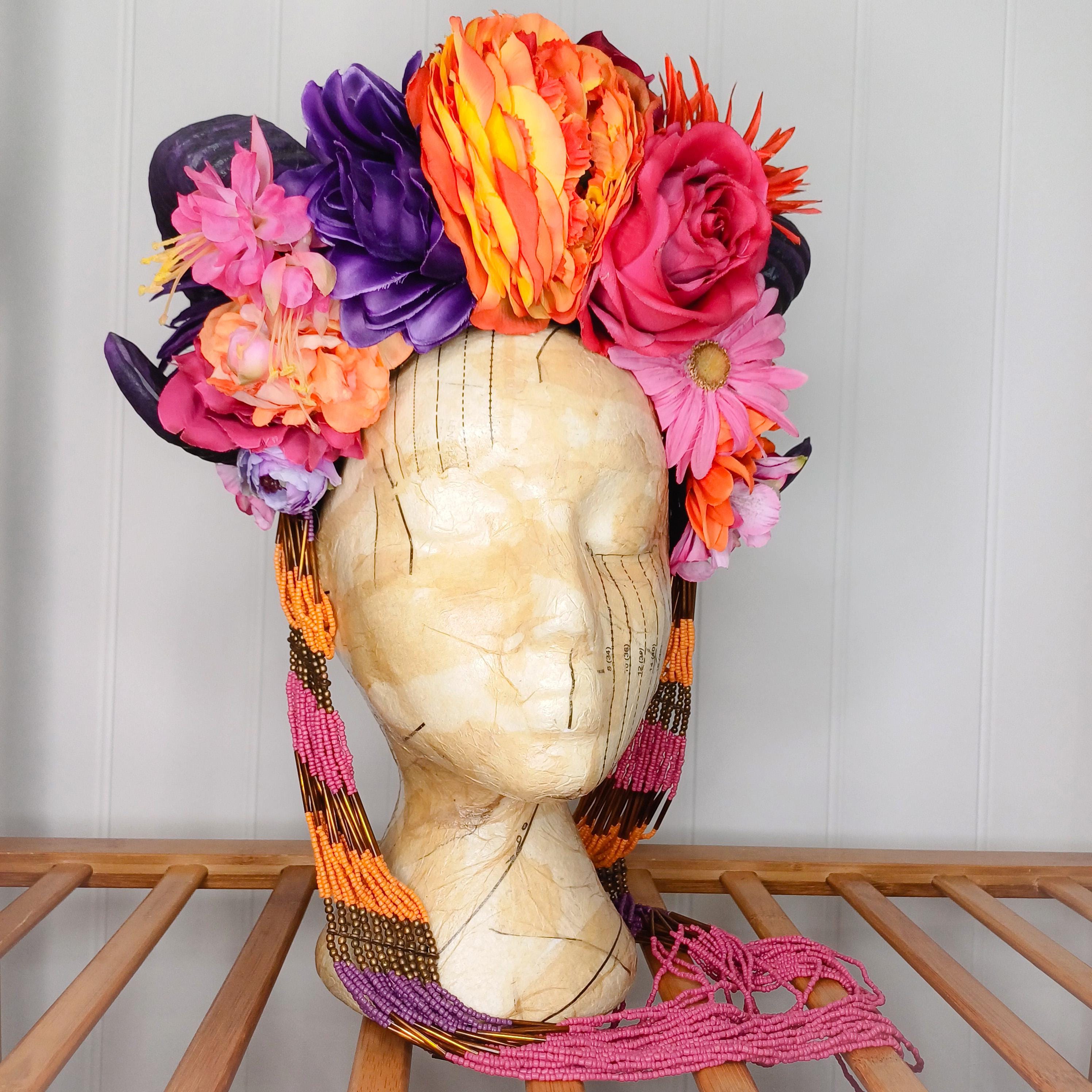 Floral headdress with horns and statement necklace