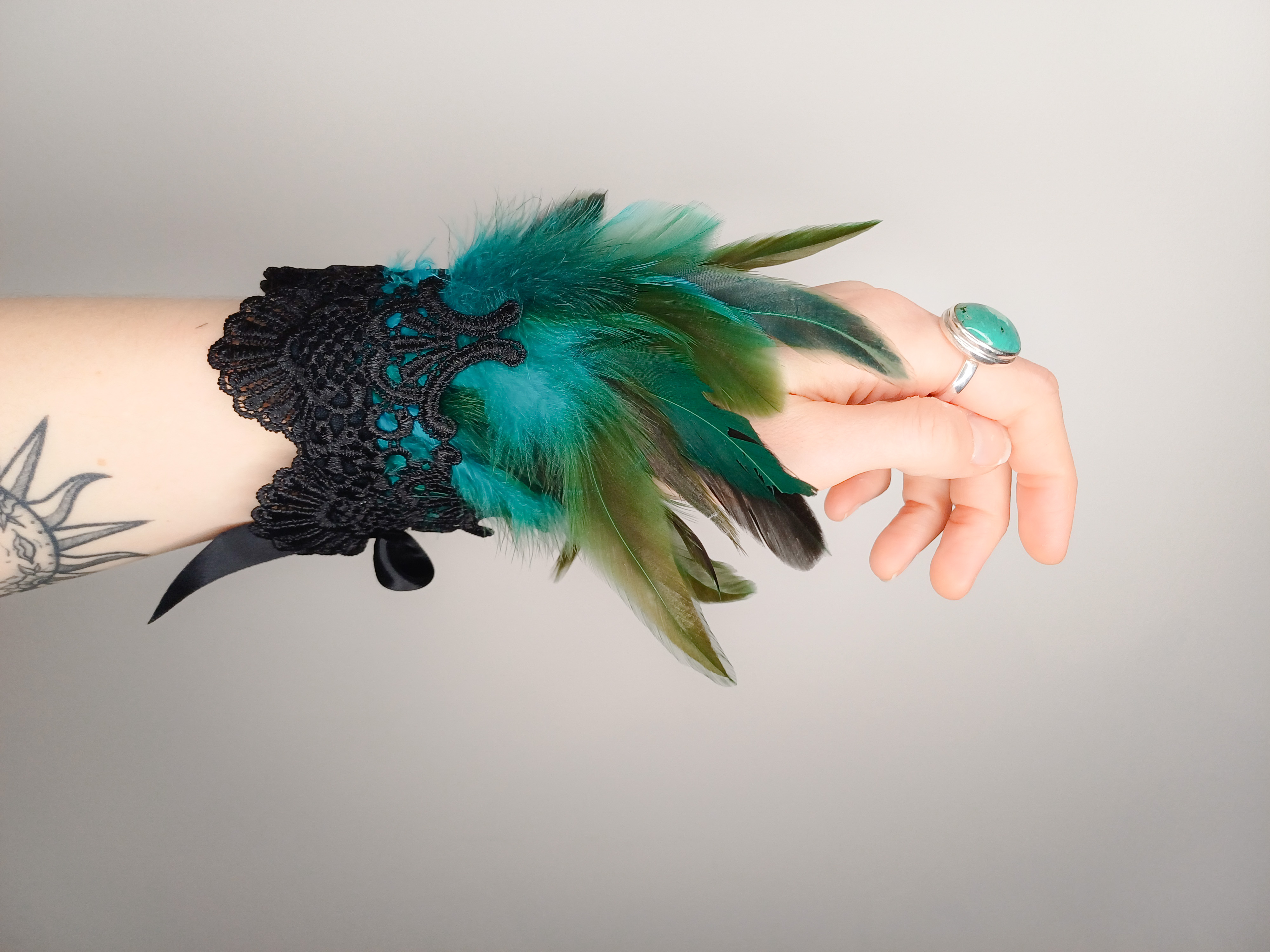 Feather and lace cuffs