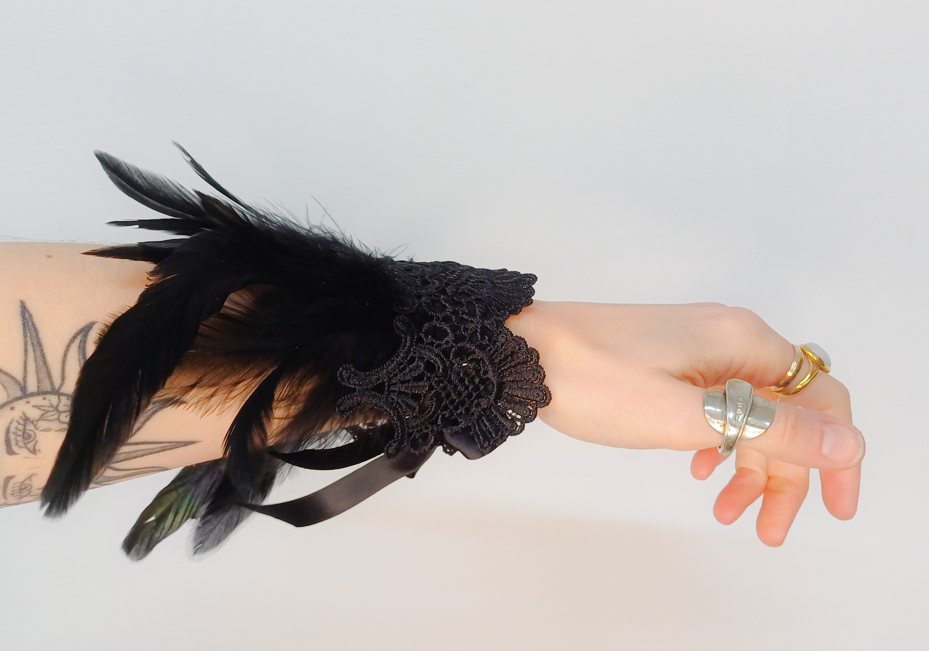 Feather and lace cuffs