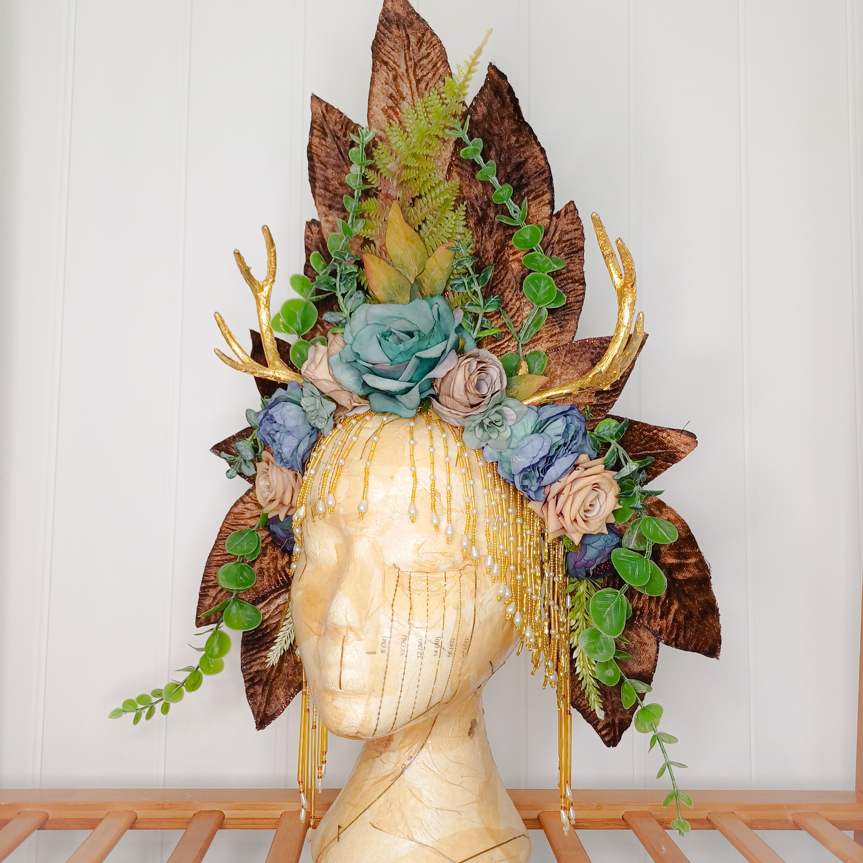 Floral headdress with gold antlers