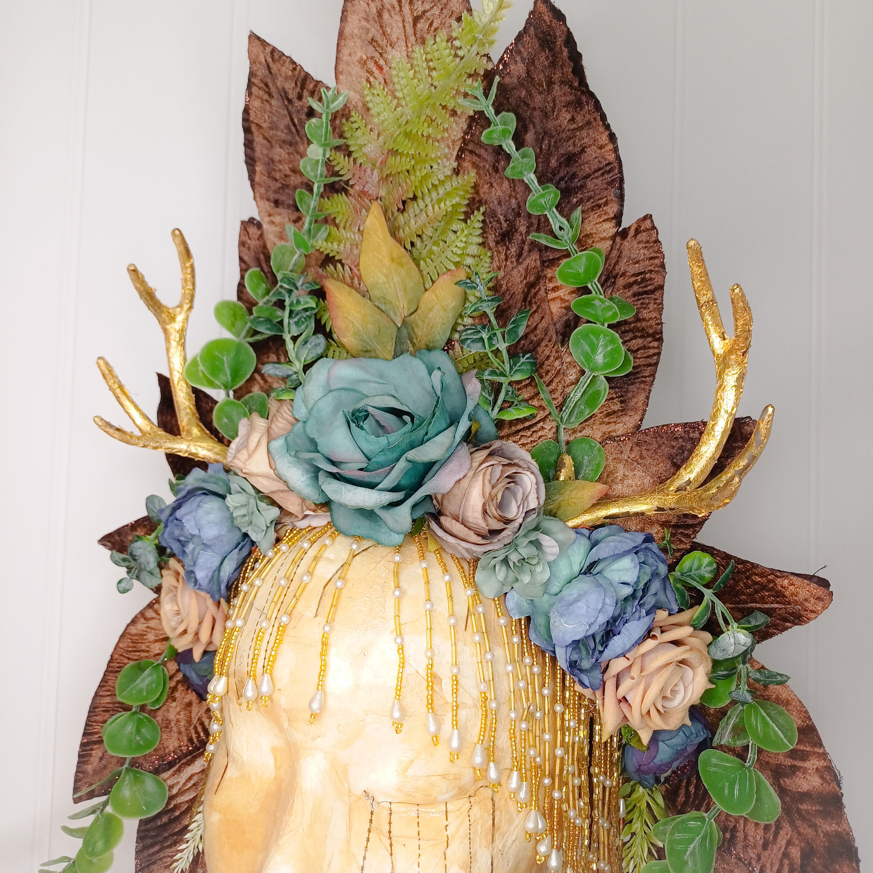 Floral headdress with gold antlers