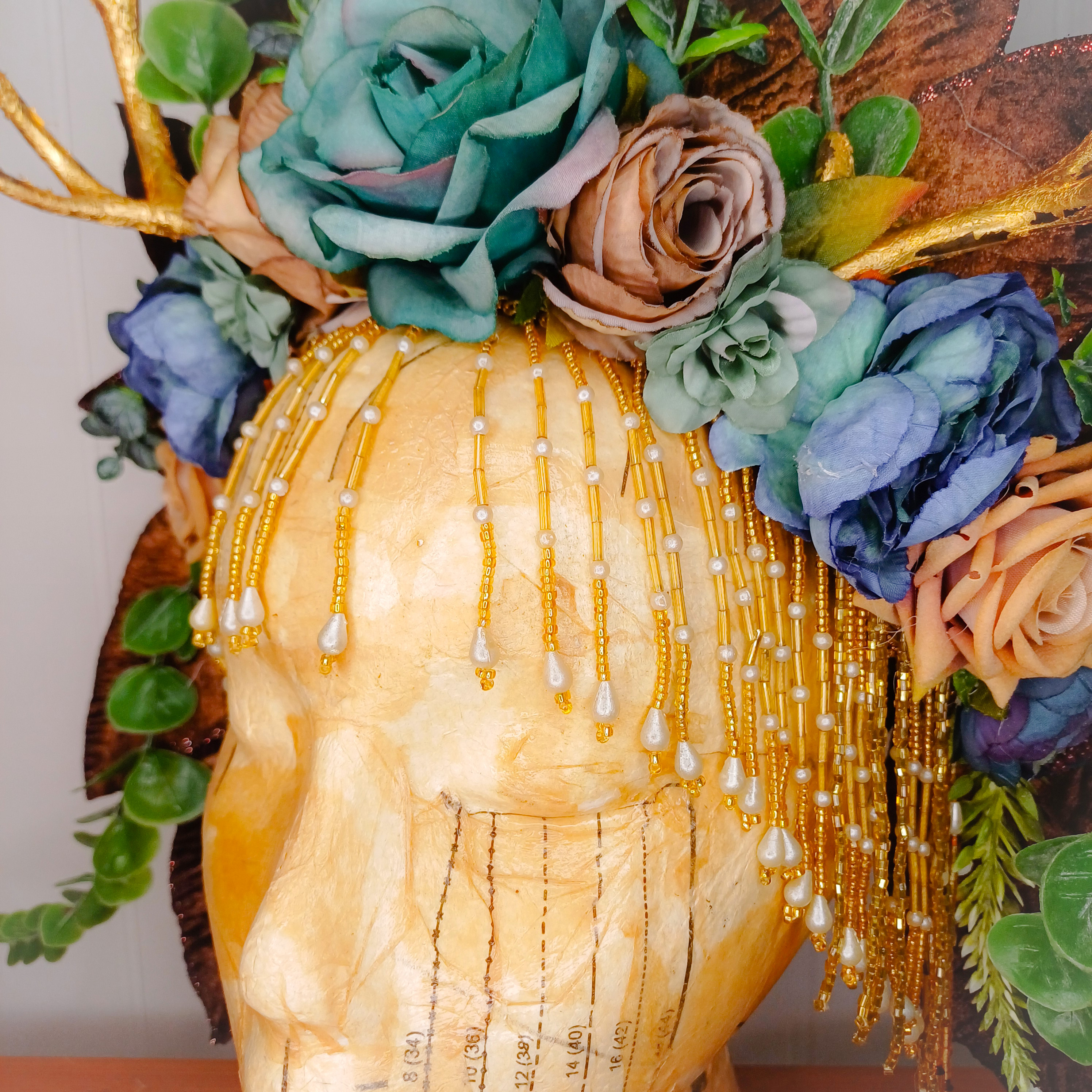 Floral headdress with gold antlers