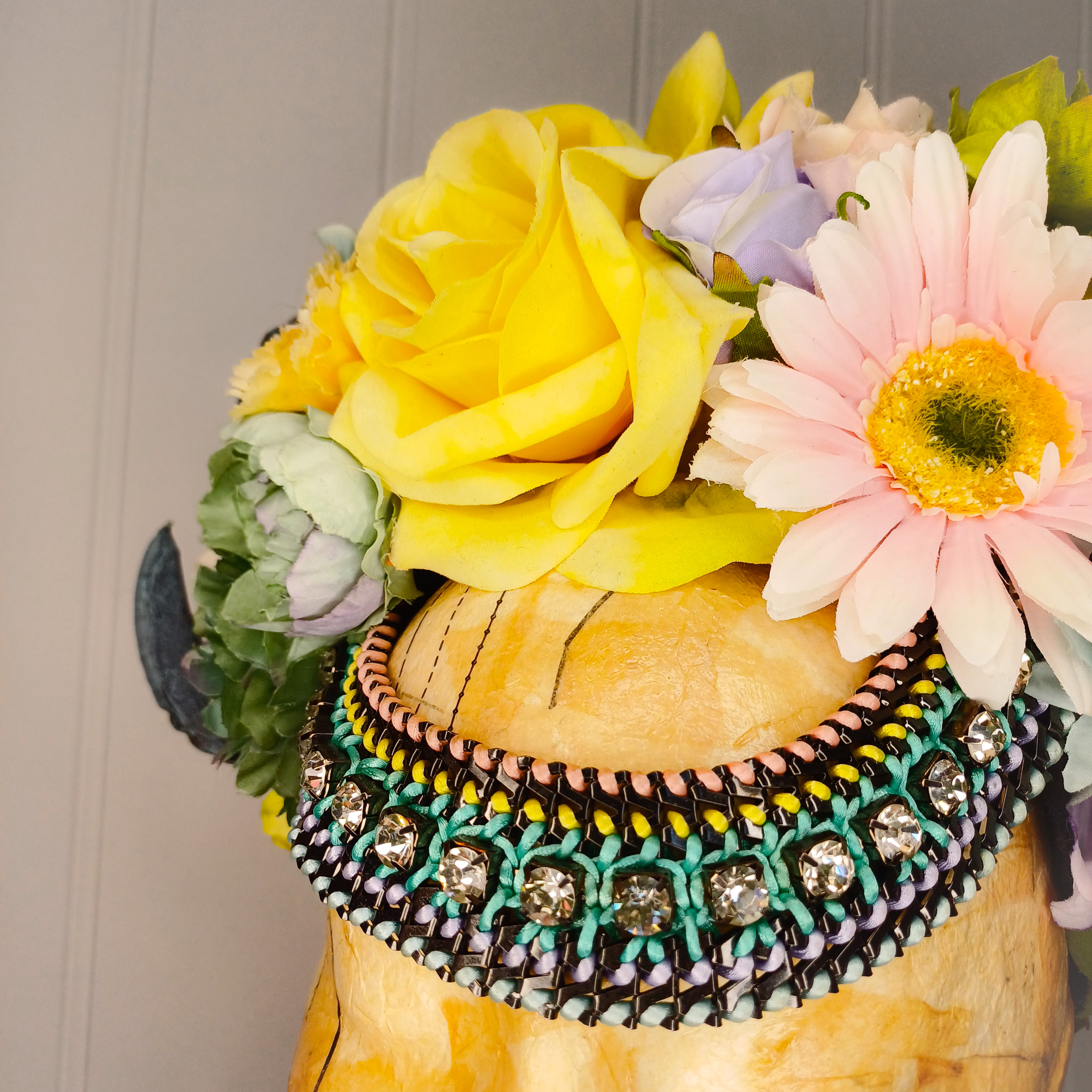 Floral headdress with ram's horns 