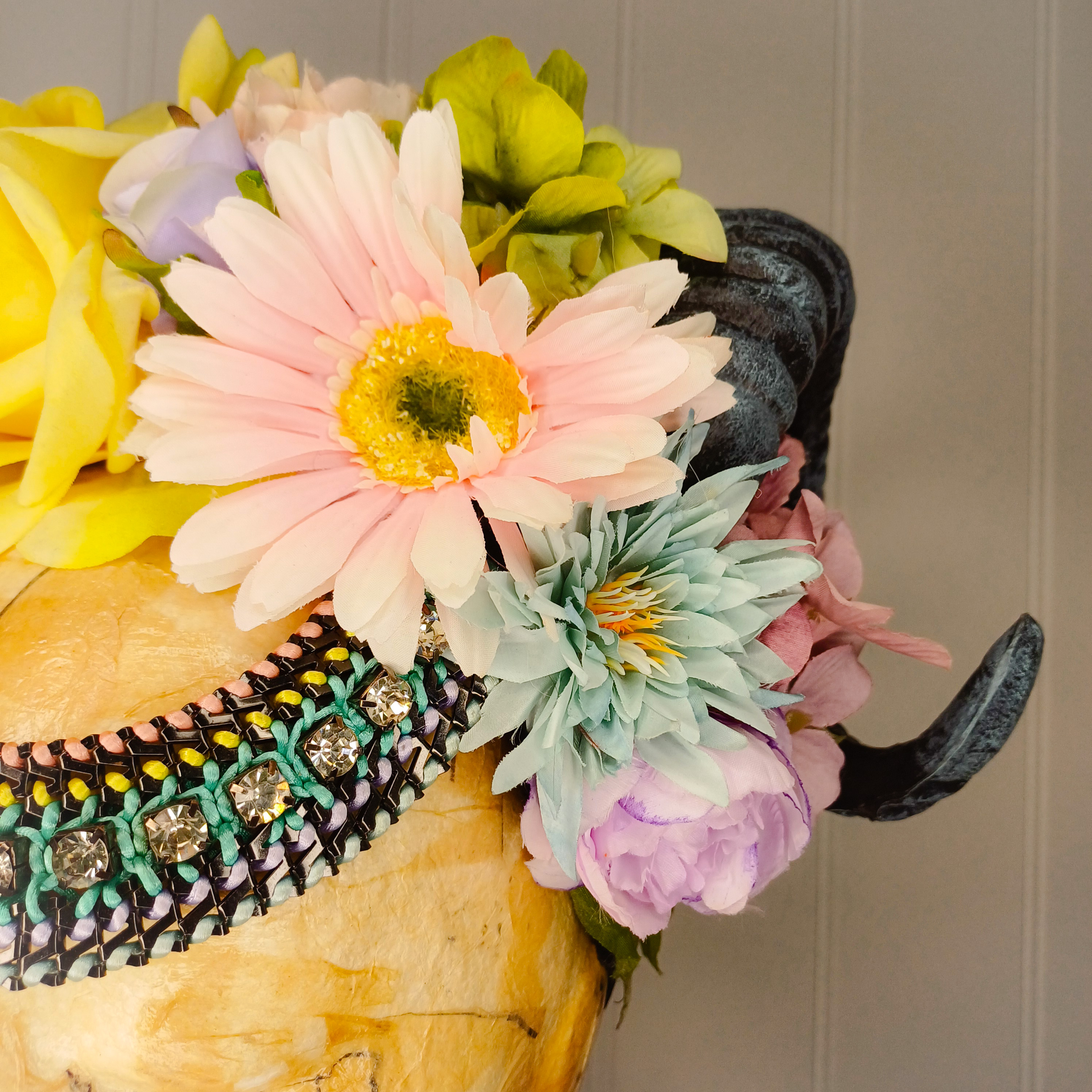 Floral headdress with ram's horns 