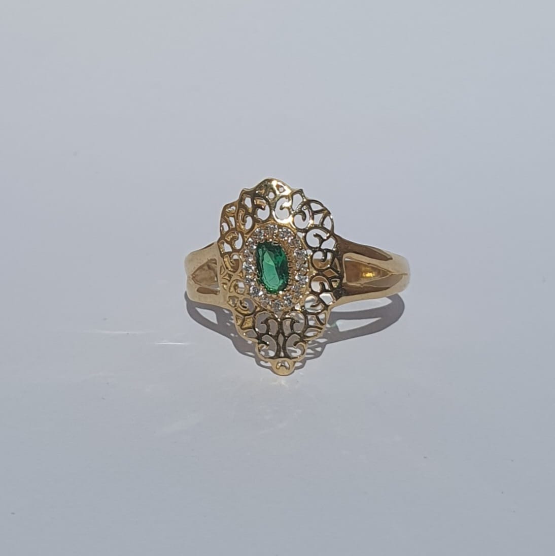 Gold ring with green stone
