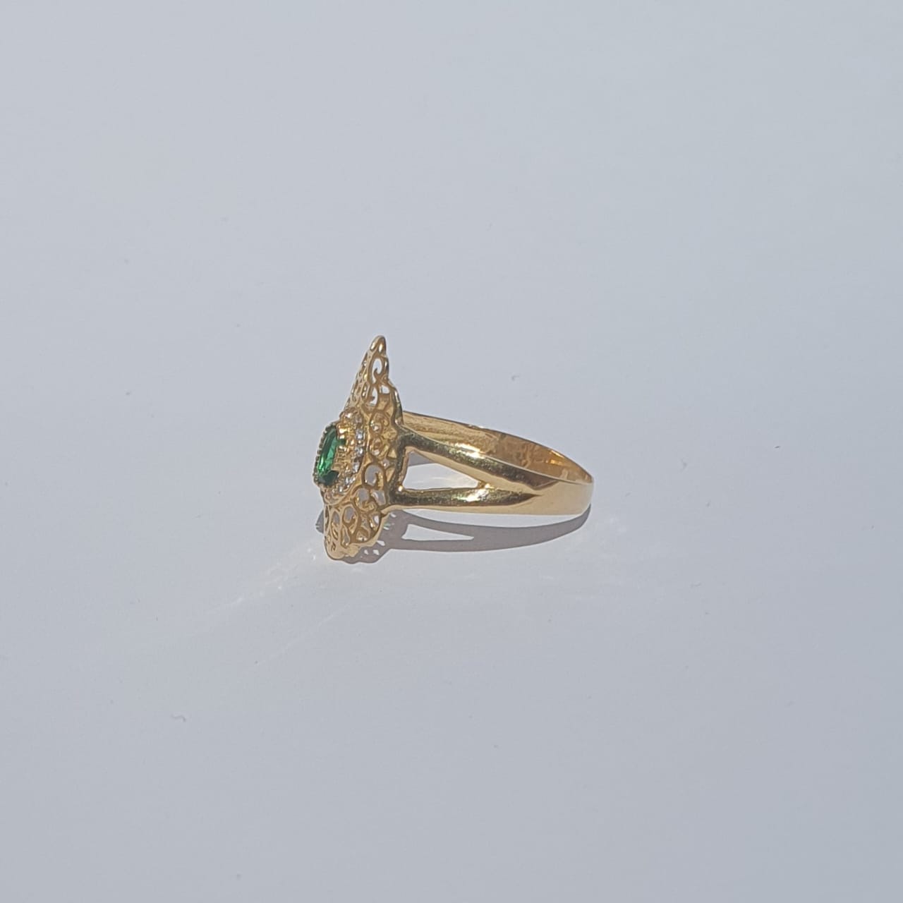 Gold ring with green stone