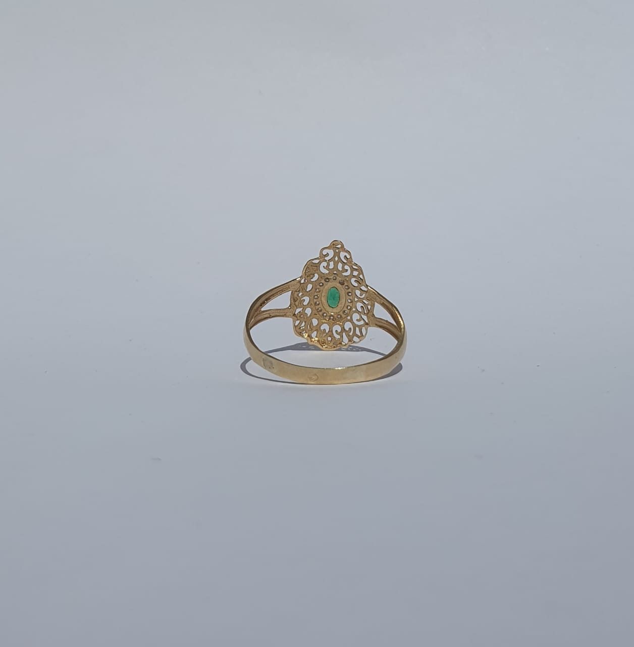Gold ring with green stone