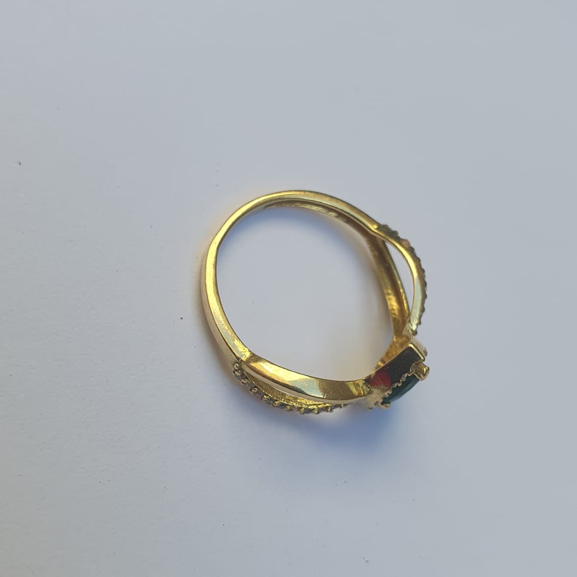 Gold ring with green stone