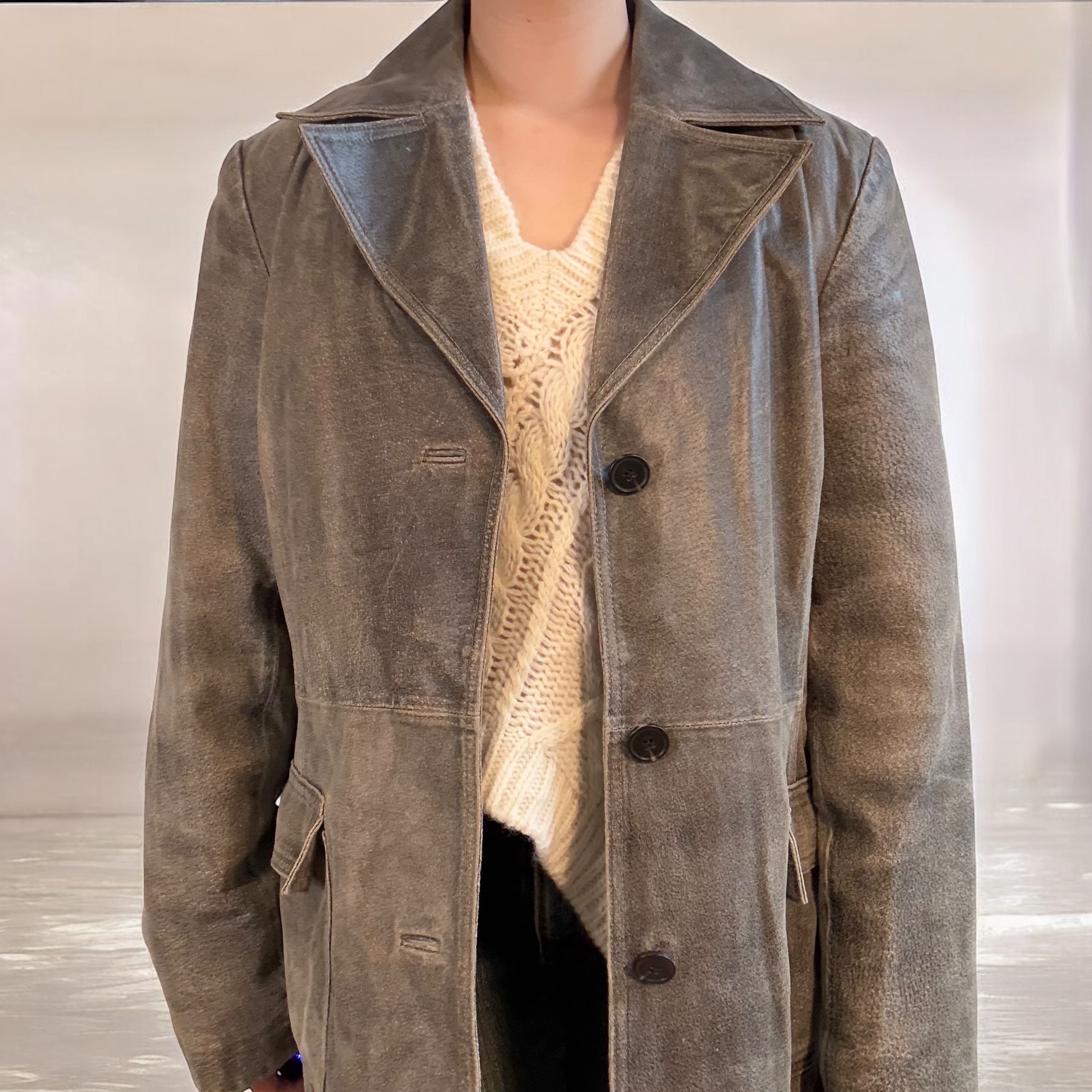 Distressed 100% leather trench coat.