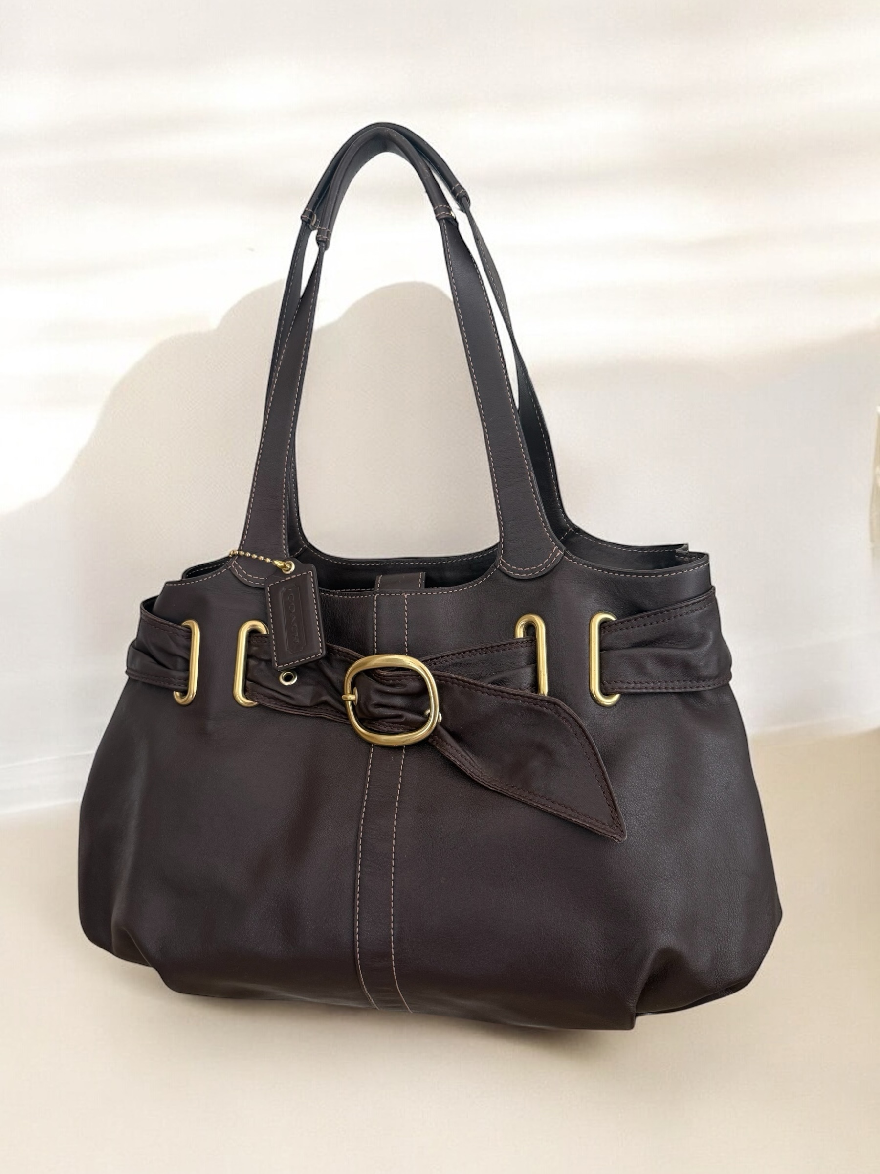 Dark brown belted Coach shoulder tote bag