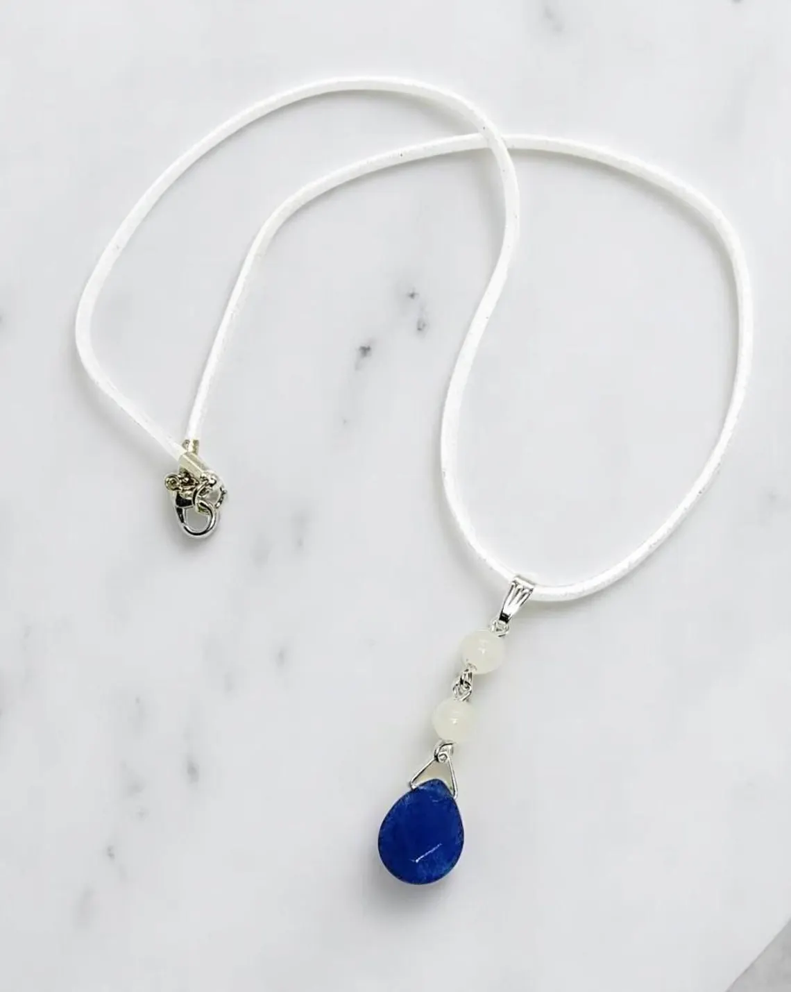 Elegant Gemstone Pendant on White Suede Cord Necklace