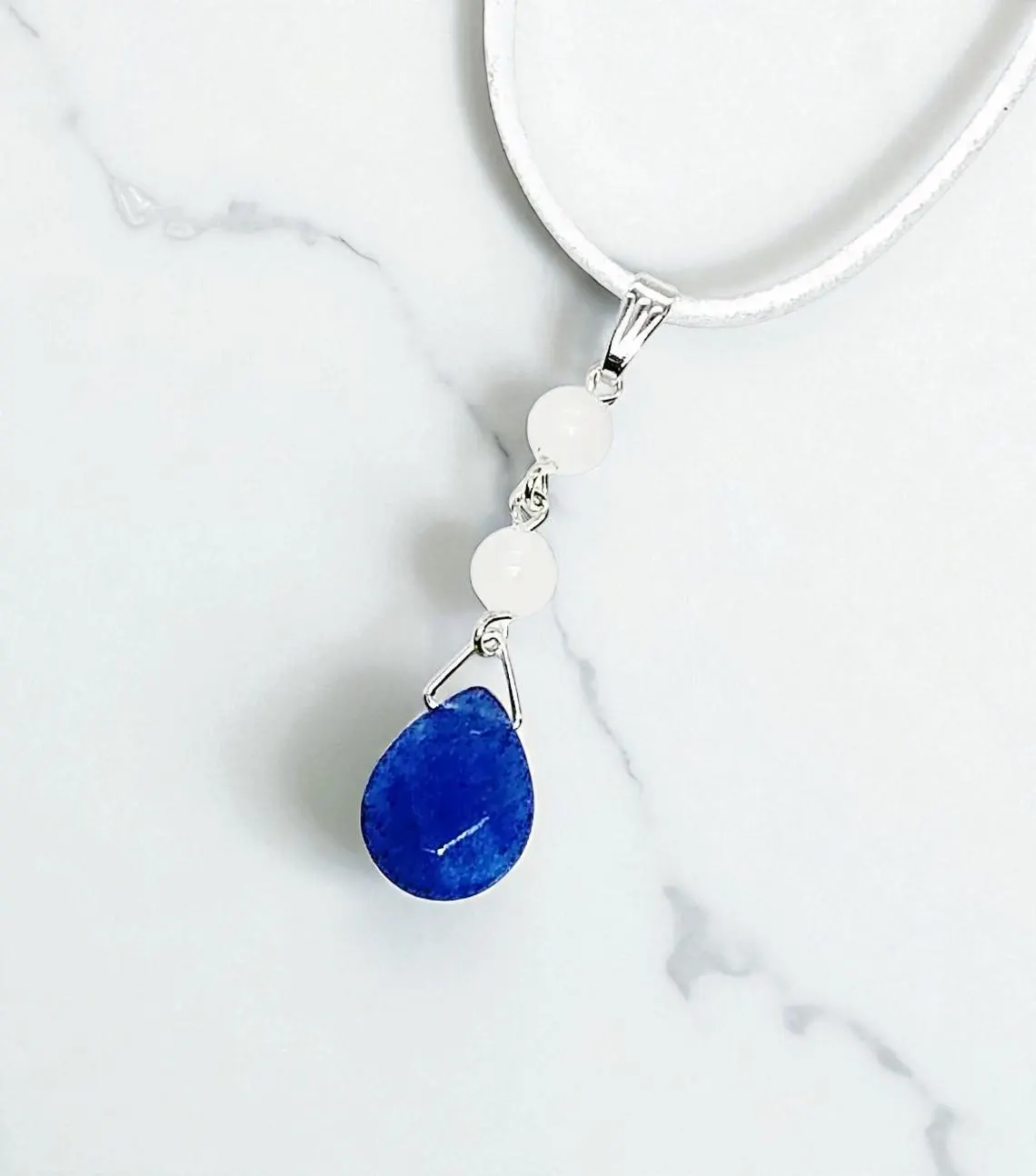 Elegant Gemstone Pendant on White Suede Cord Necklace