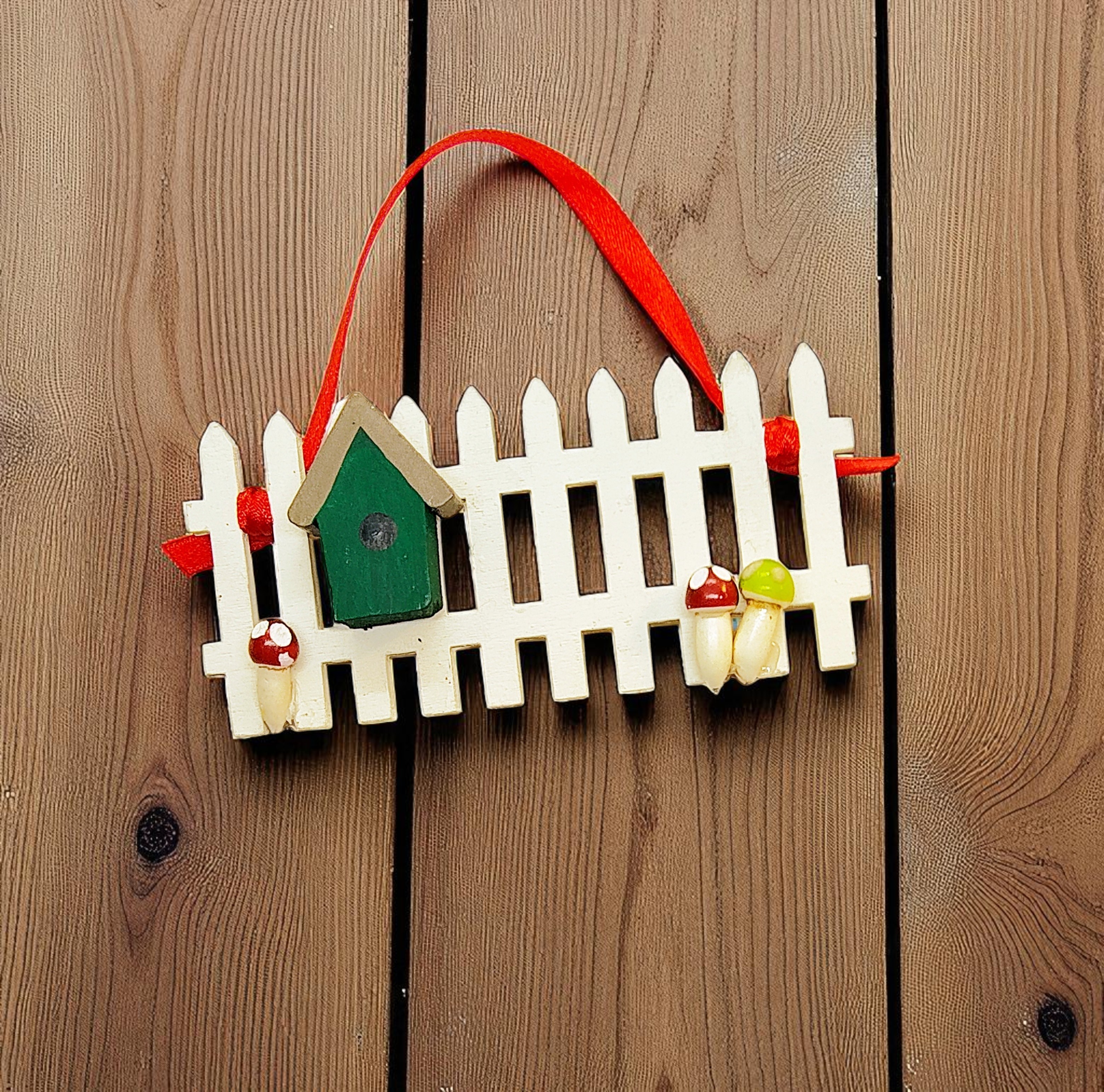 Wooden Picket Fence with Birdhouse Ornament