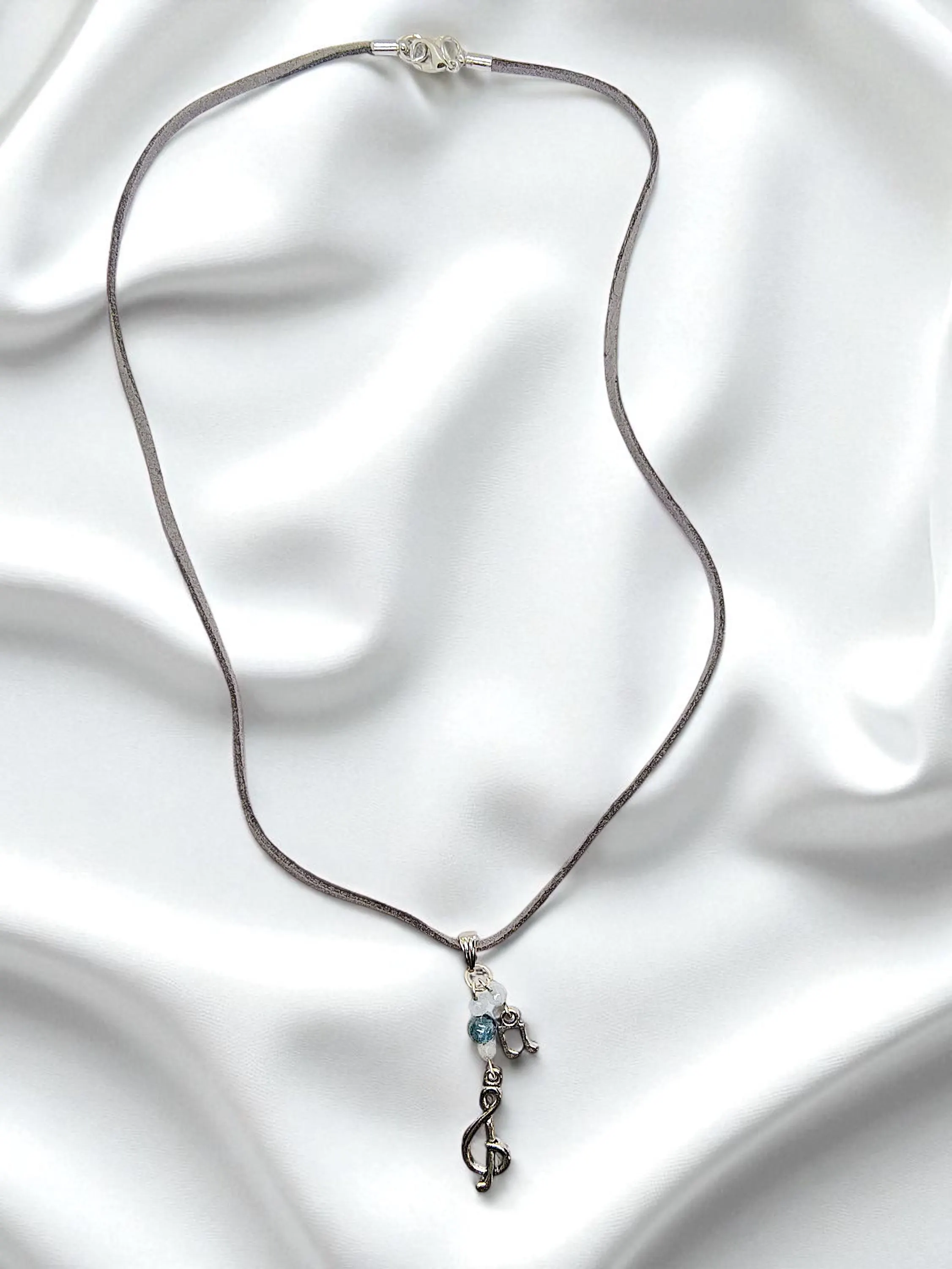 Music Note, Treble Clef, & Gemstone Pendant on Gray Suede Cord Necklace