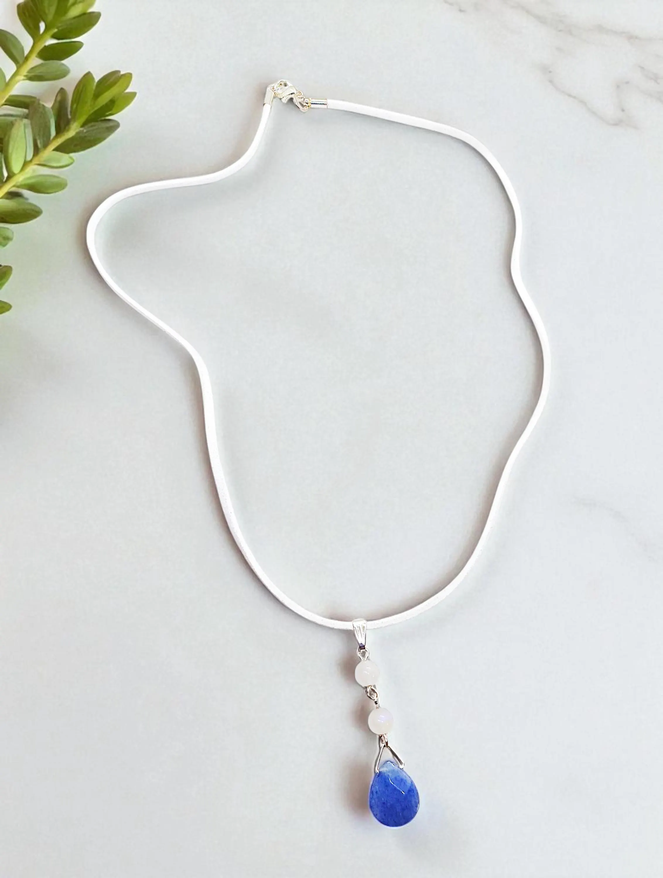 Elegant Gemstone Pendant on White Suede Cord Necklace