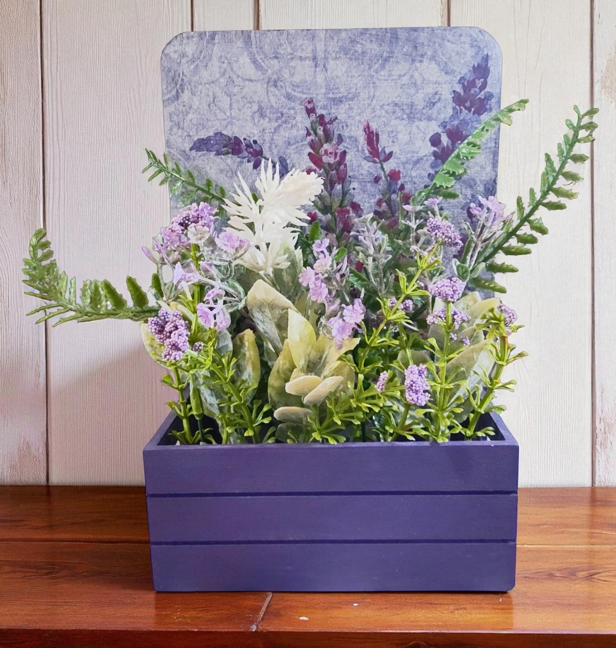 Artificial Flower Arrangement in Purple Wooden Decoupaged Planter 