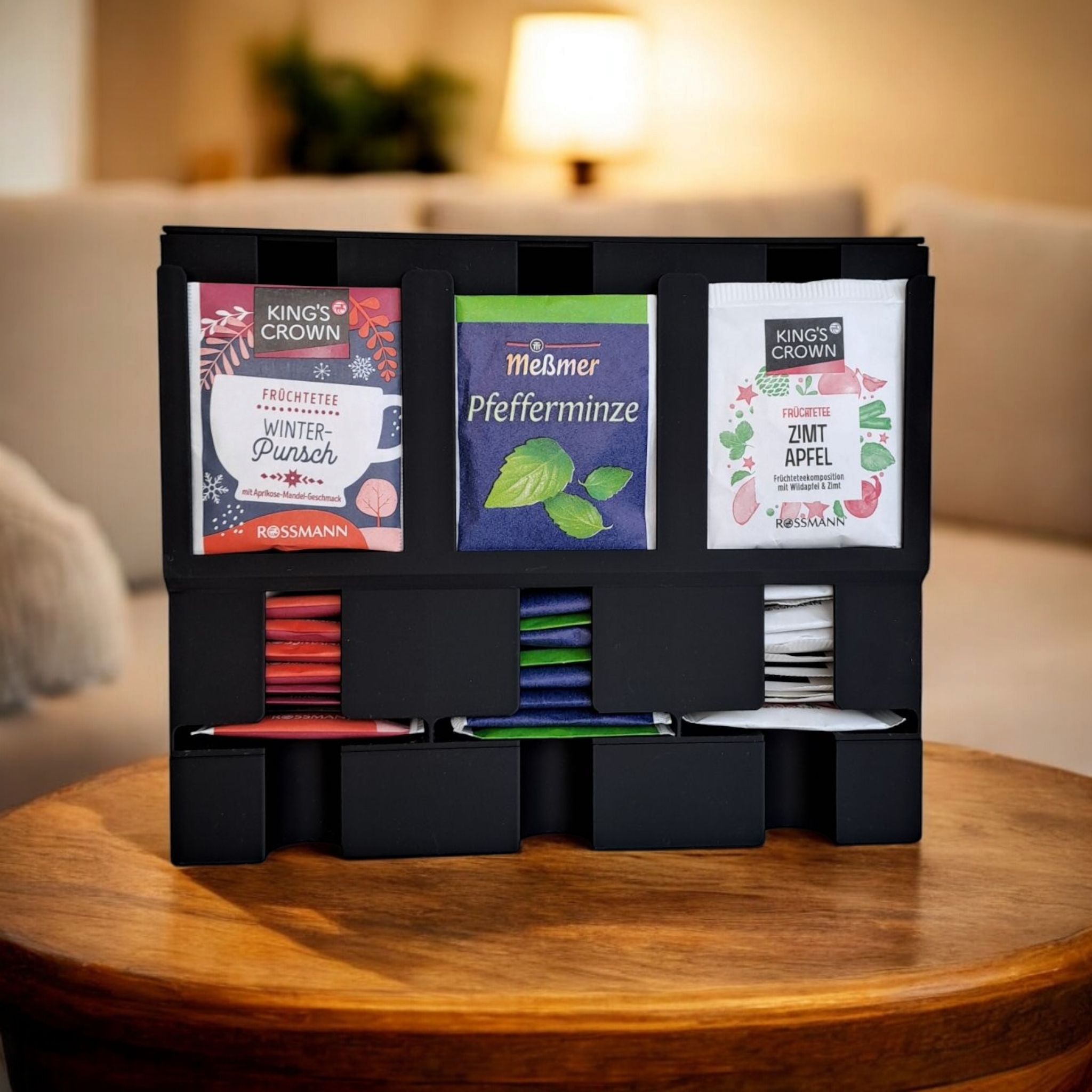 Vertikalus arbatos pakelių laikiklis–dozatorius