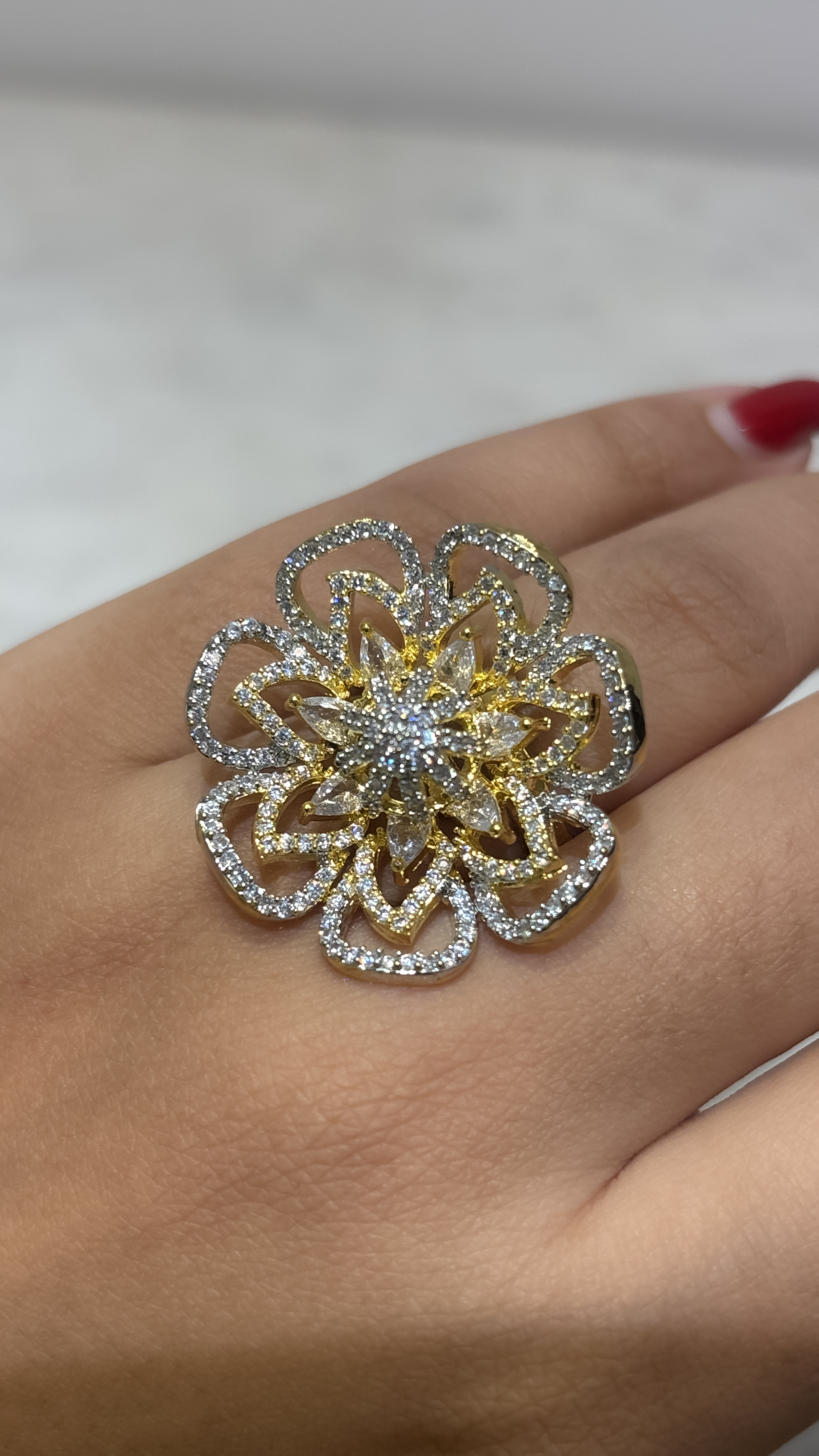 Adjustable floral gold plated ring