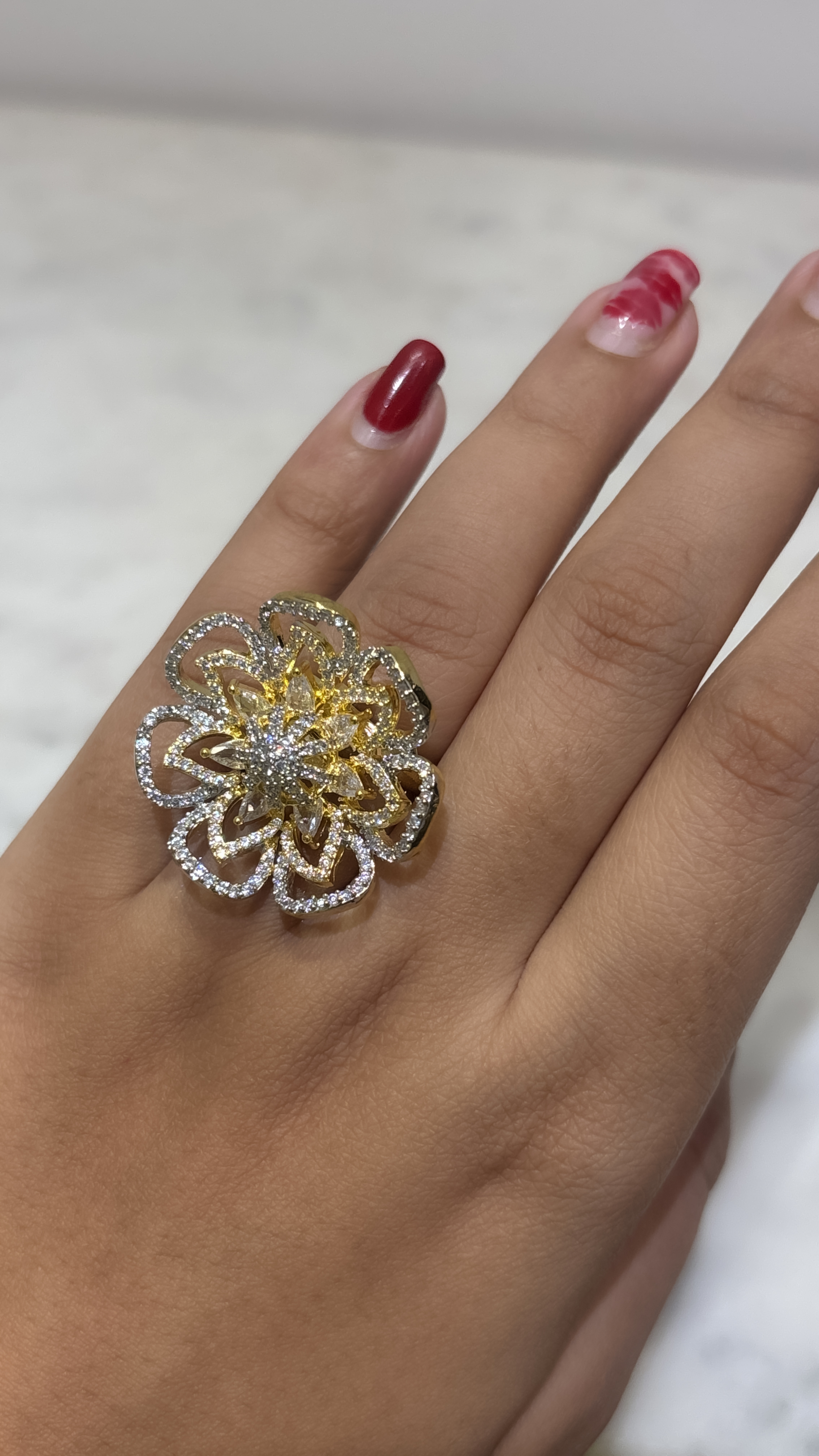 Adjustable floral gold plated ring