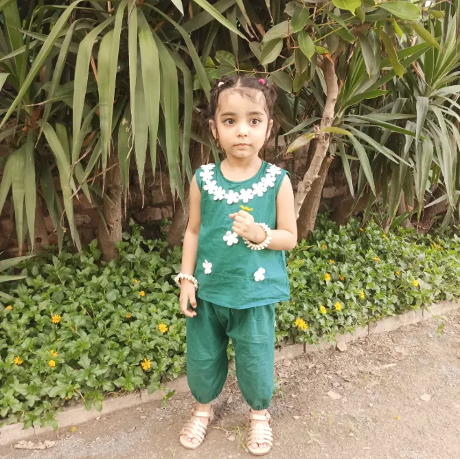 Green Blossom Comfort Set A Pakistani baby girl in a green dress with white 3D flowers, an Pakistani Independence Day outfit.