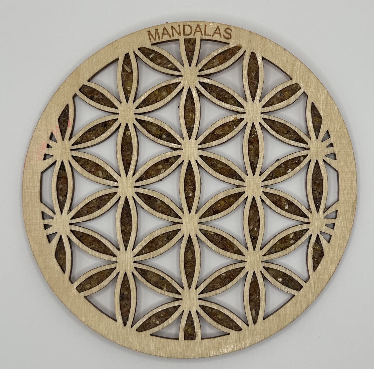 Fleur de vie incrustée d'ambre