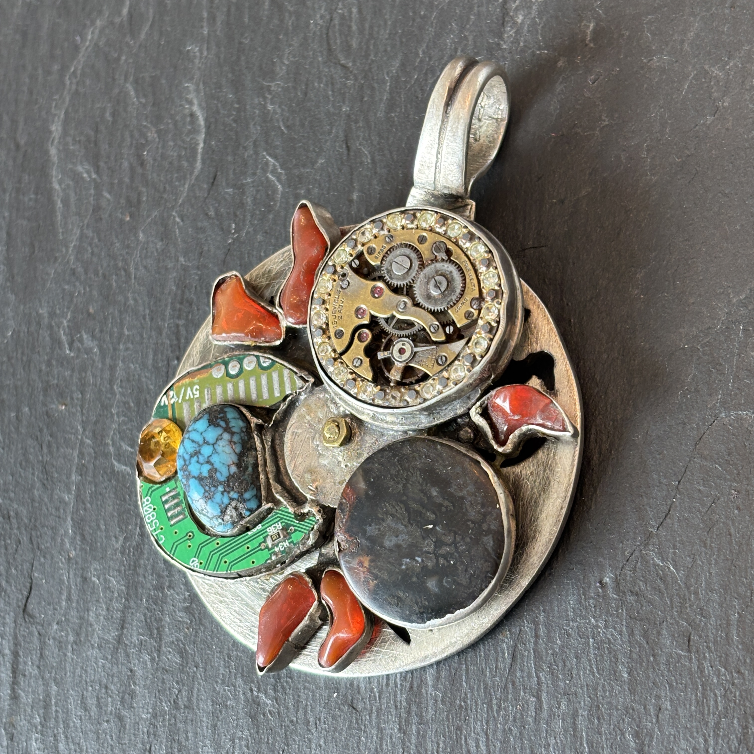 Robert Mac Eustace Jones, Zuni Procession of the Equinox Articulating Sterling Pendant 