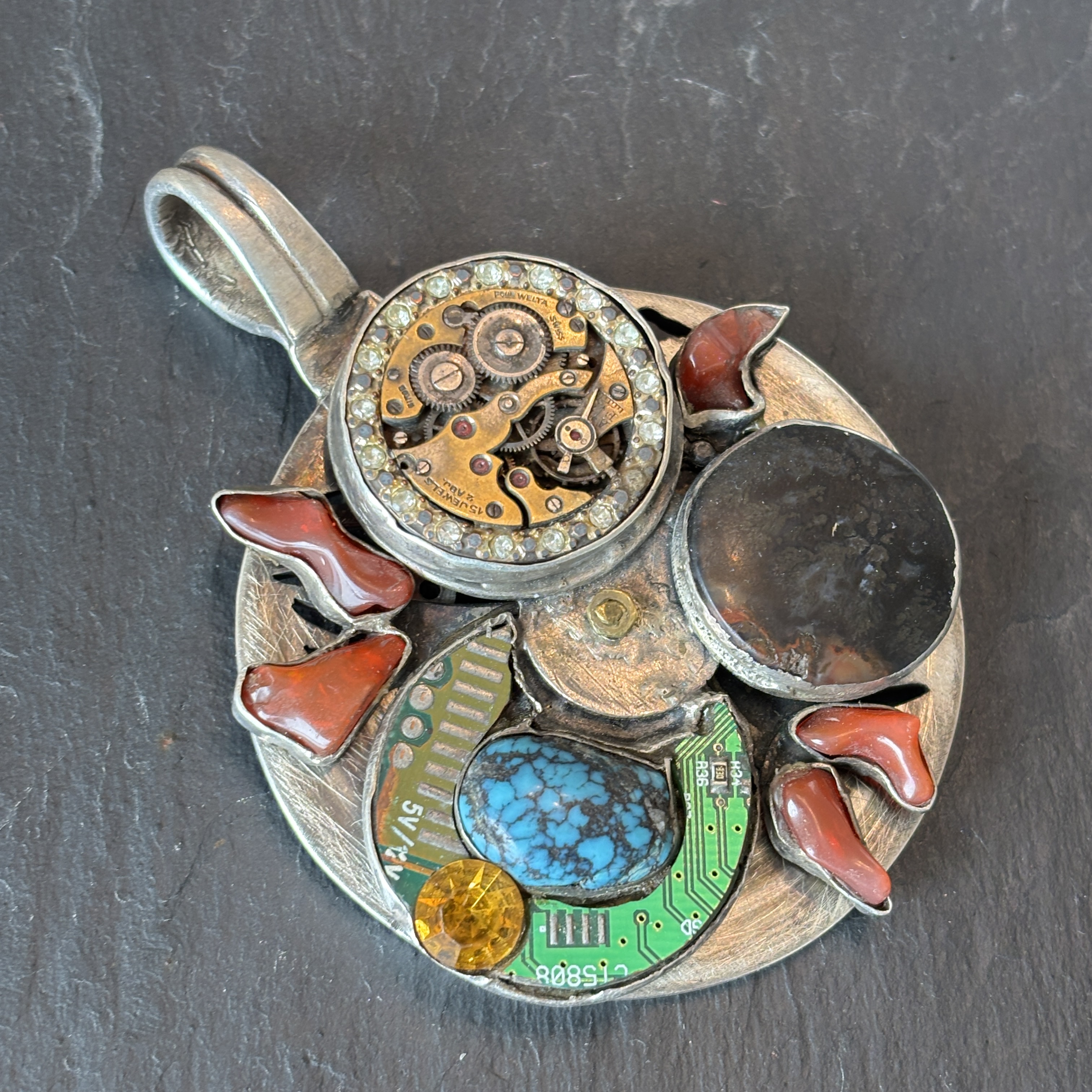 Robert Mac Eustace Jones, Zuni Procession of the Equinox Articulating Sterling Pendant 