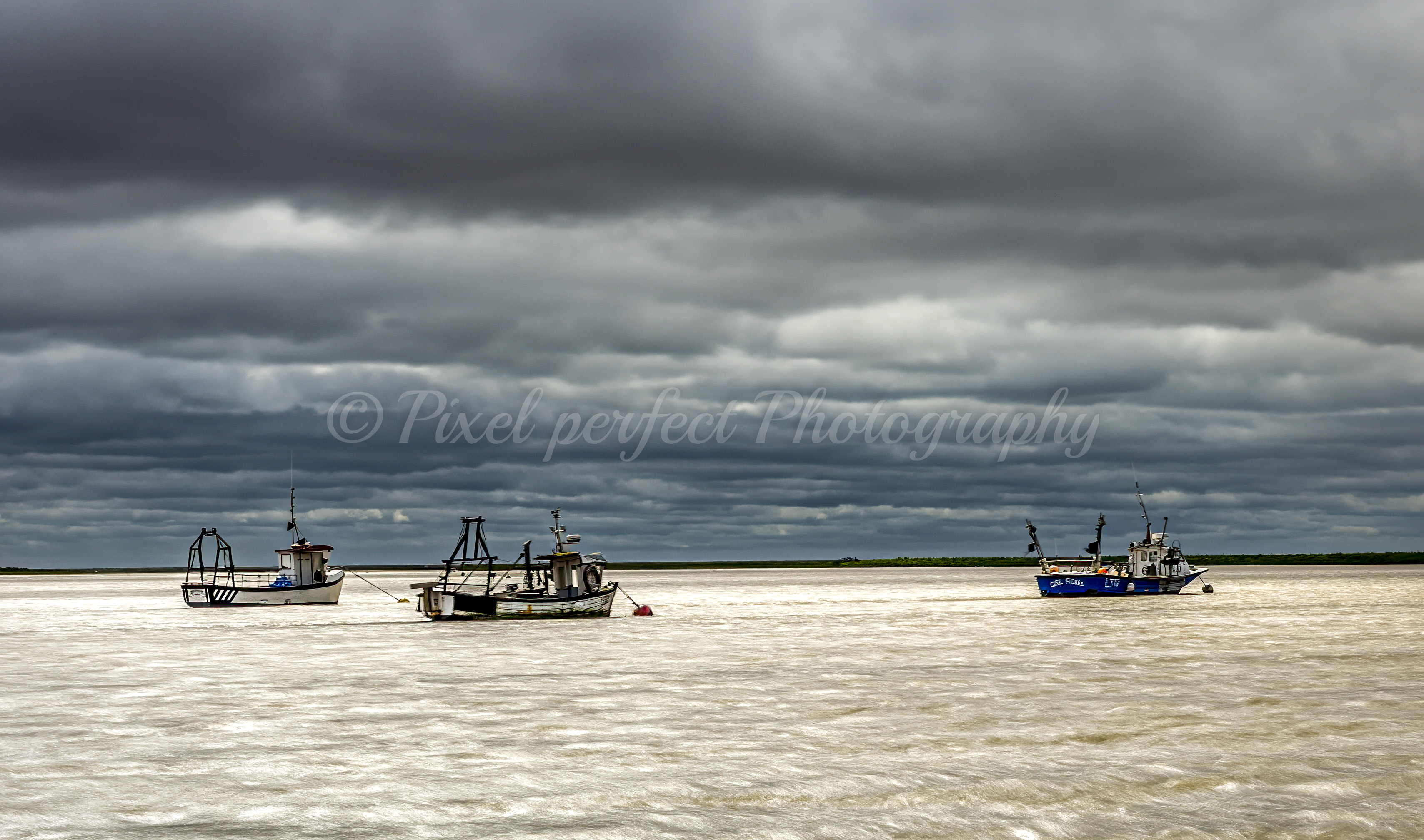 Fishing Boats on a Stormy Sea